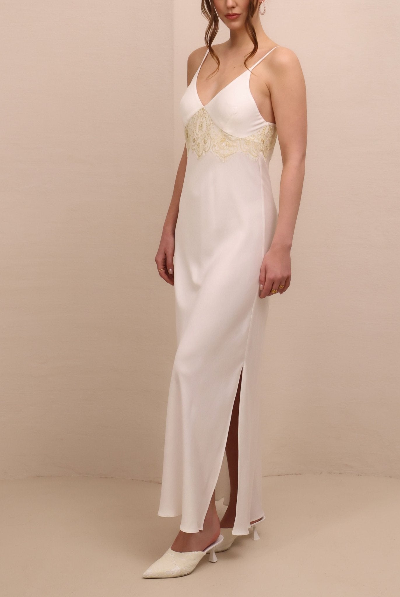 Side perspective of the nightdress, highlighting the subtle slit designed for movement and a soft, feminine fit.