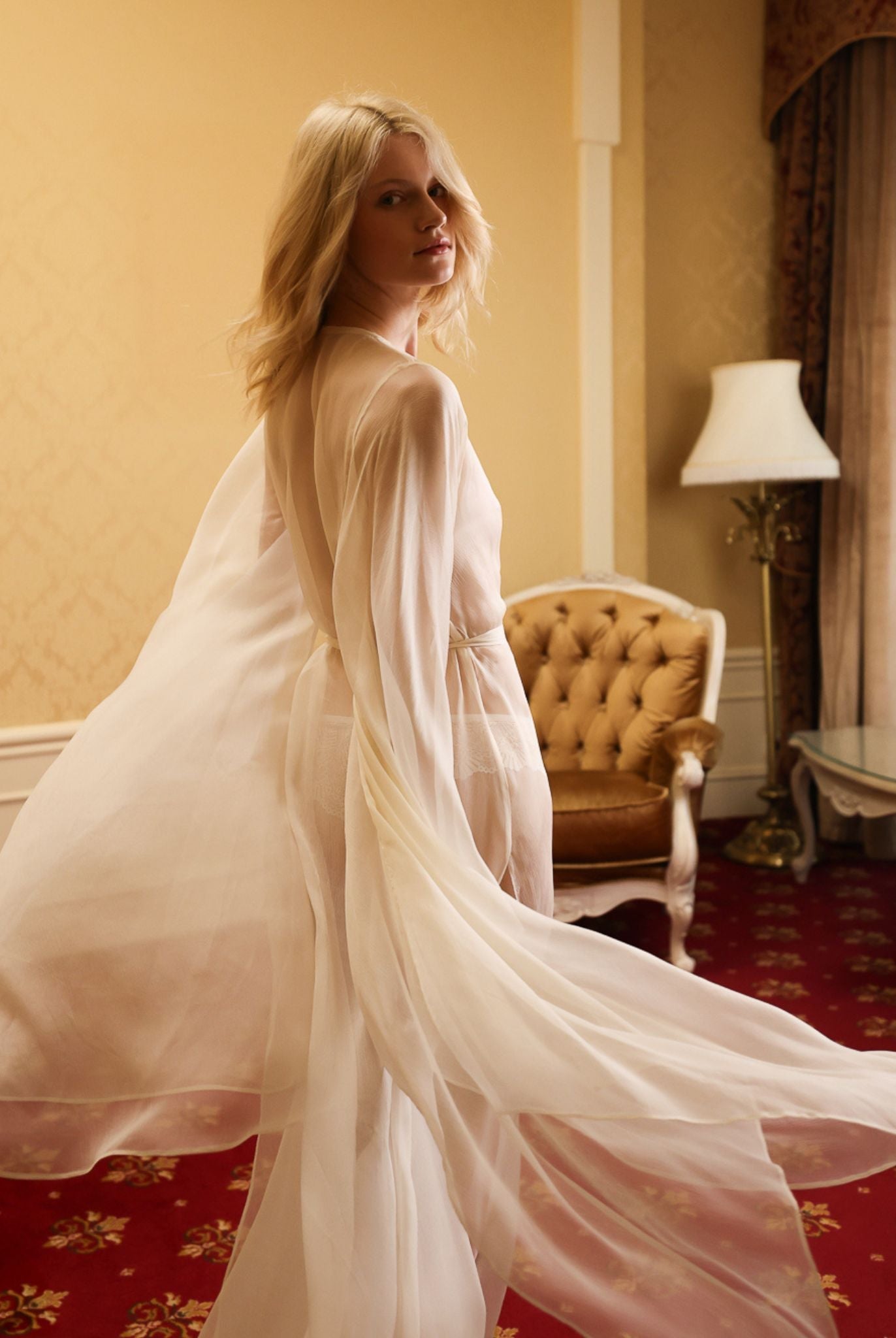 Mid-length shot highlighting the airy texture and graceful movement of the delicate 100% mulberry silk fabric.