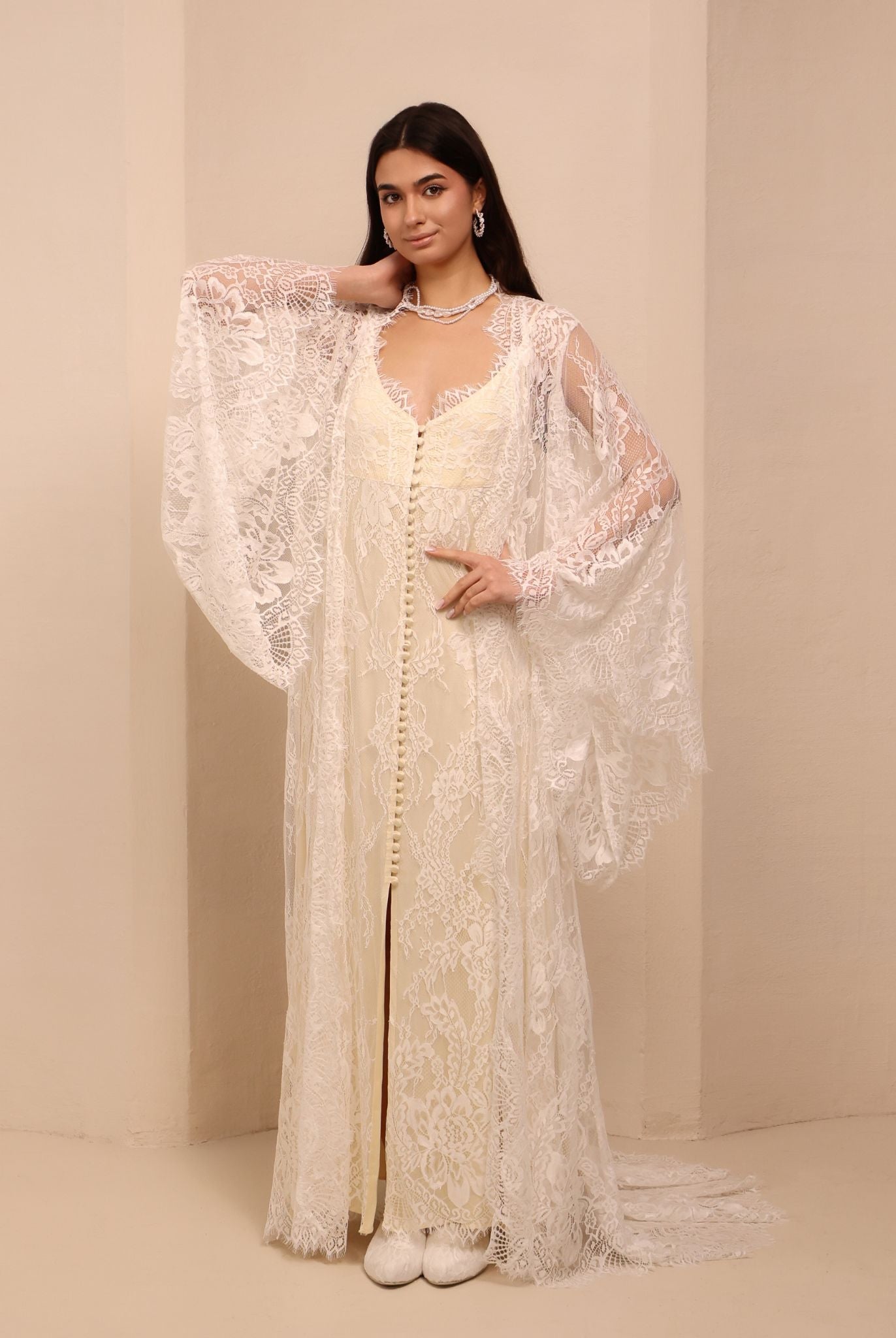 A posed view of the Robe and Nightgown Set with one hand on the waist and the other near the neck.