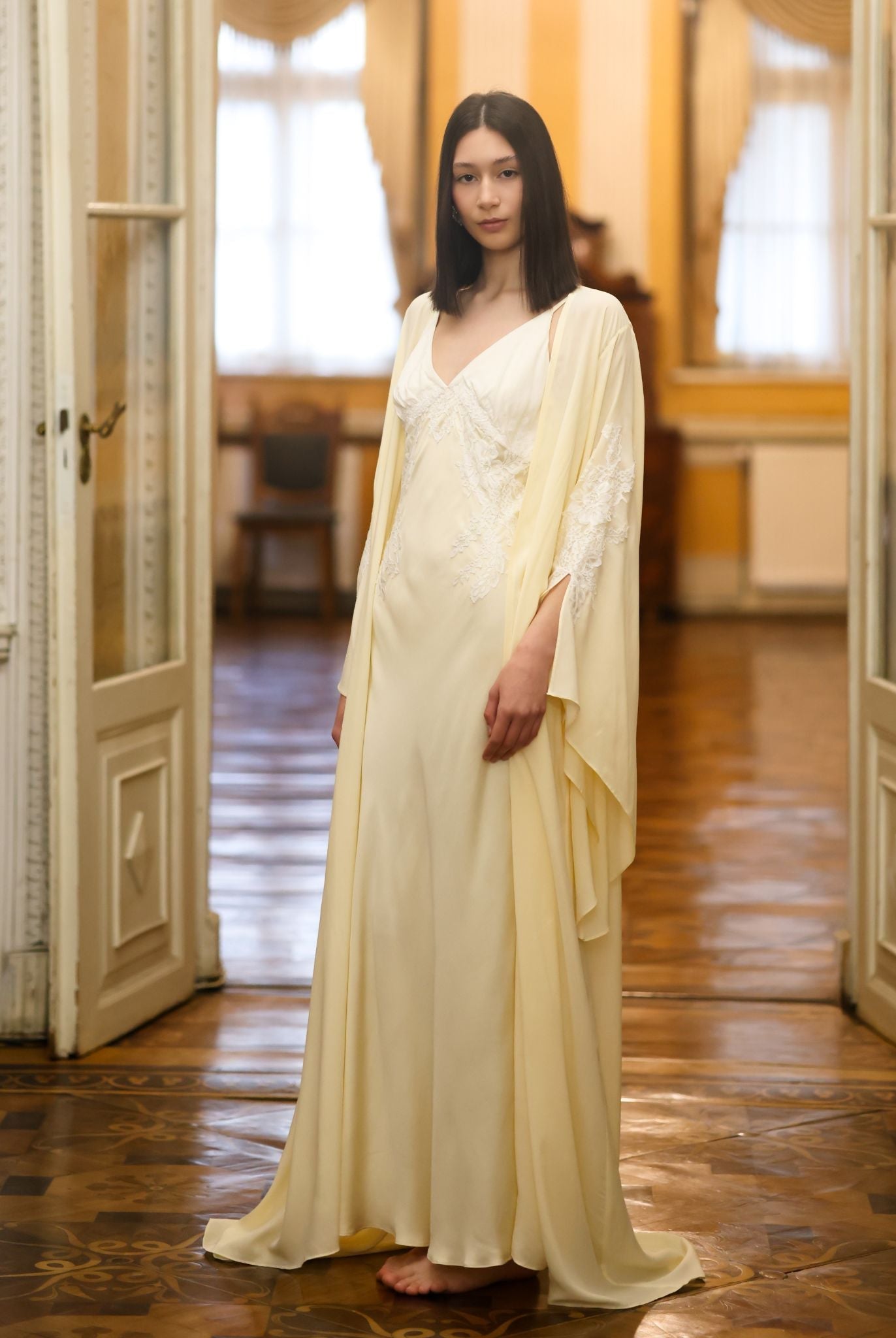 Side perspective of the attire, illustrating how the bias-cut fabric glides effortlessly along the body.