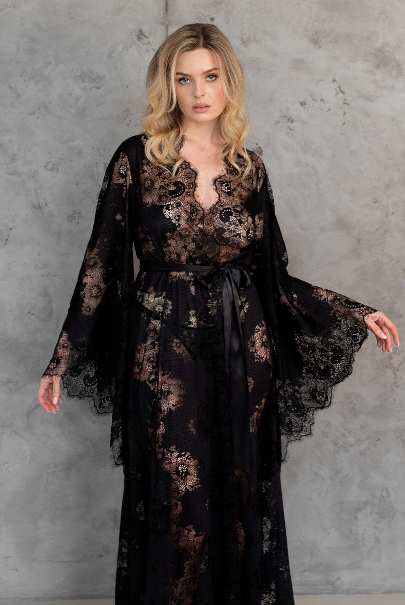 Woman in black lace robe, standing – KÂfemme