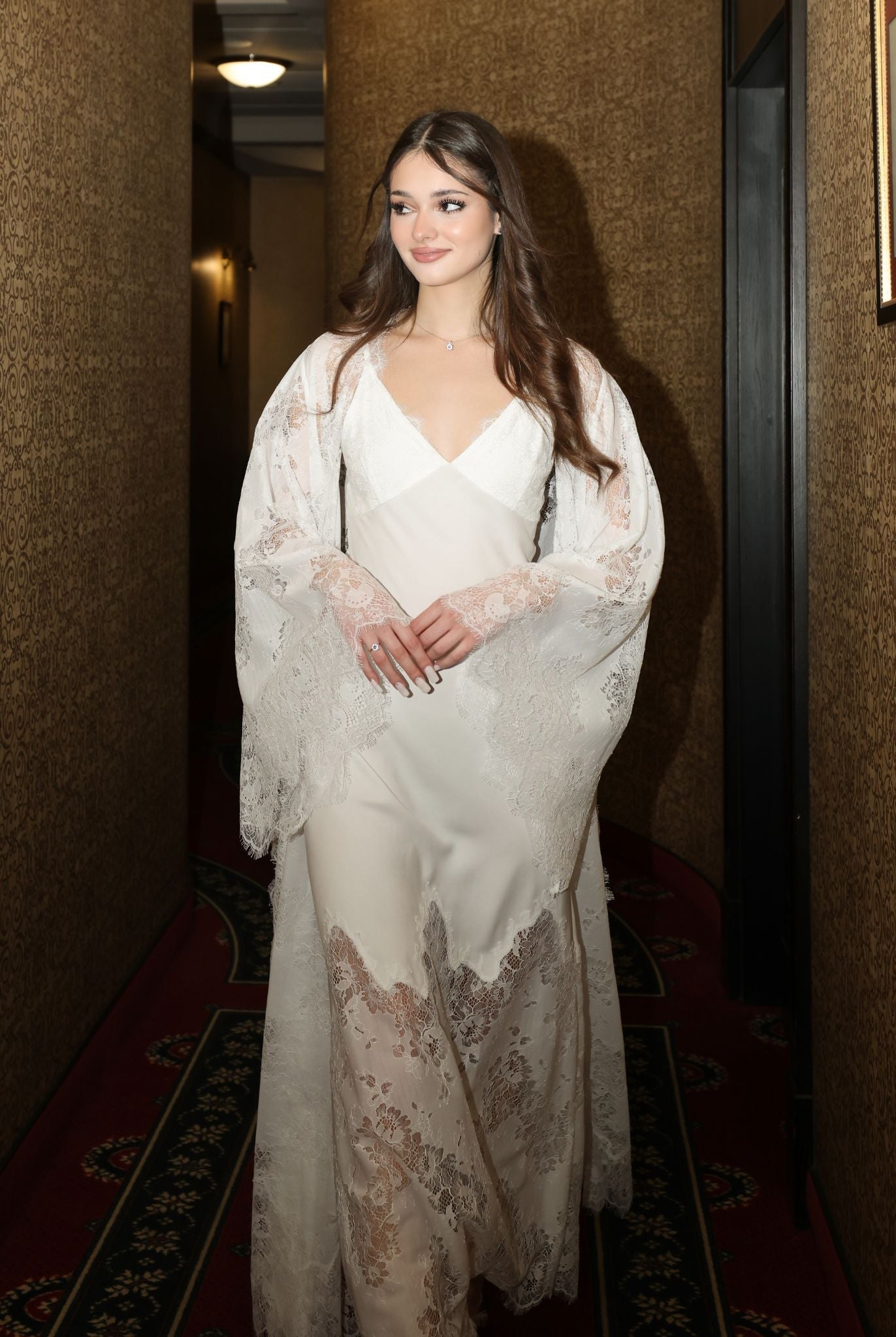 Atmospheric photo of the elegant set in a hotel setting, capturing a mood of quiet luxury and refinement.