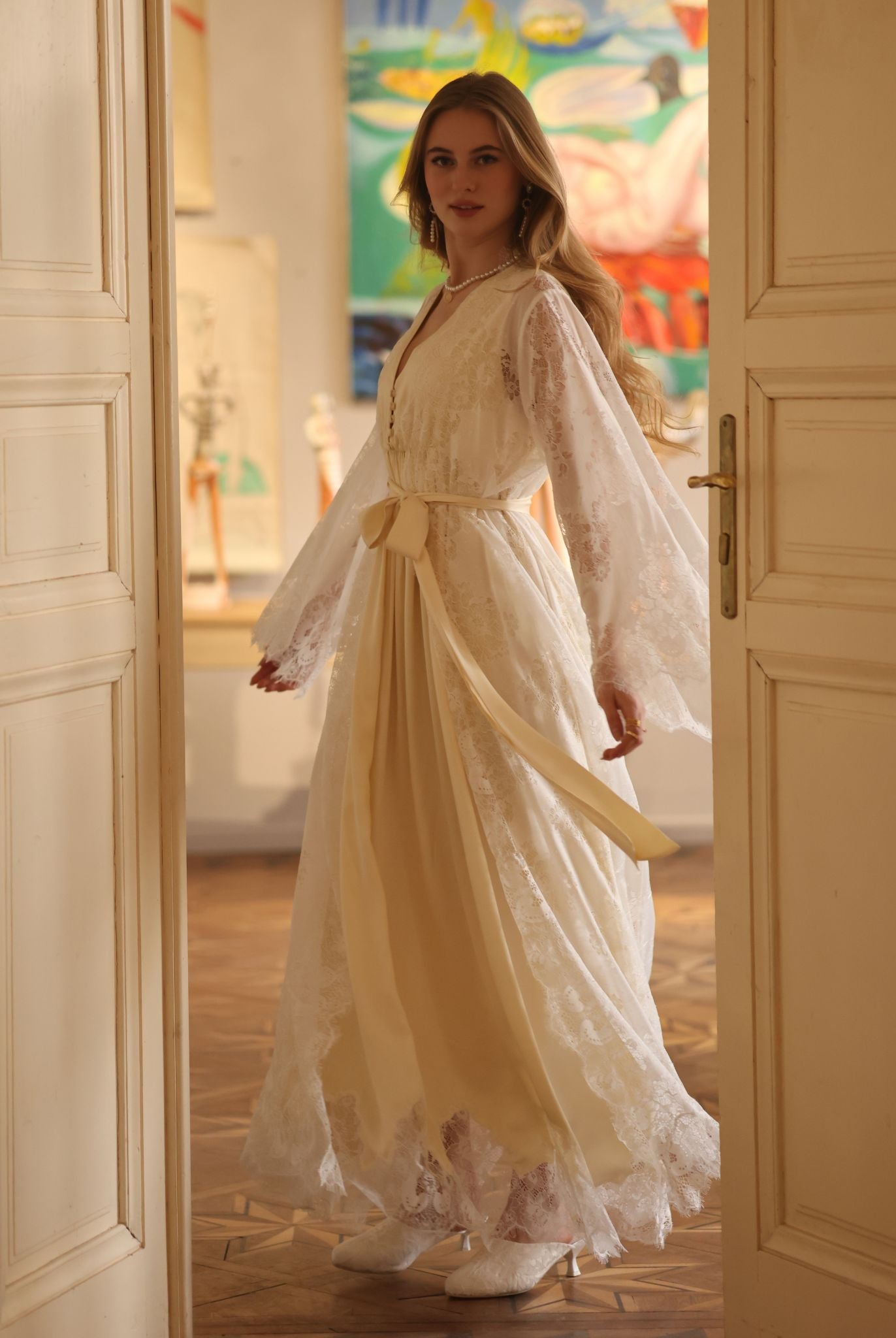 A dynamic turn in the Robe and Nightgown Set, capturing the movement of delicate lace and flowing fabric.