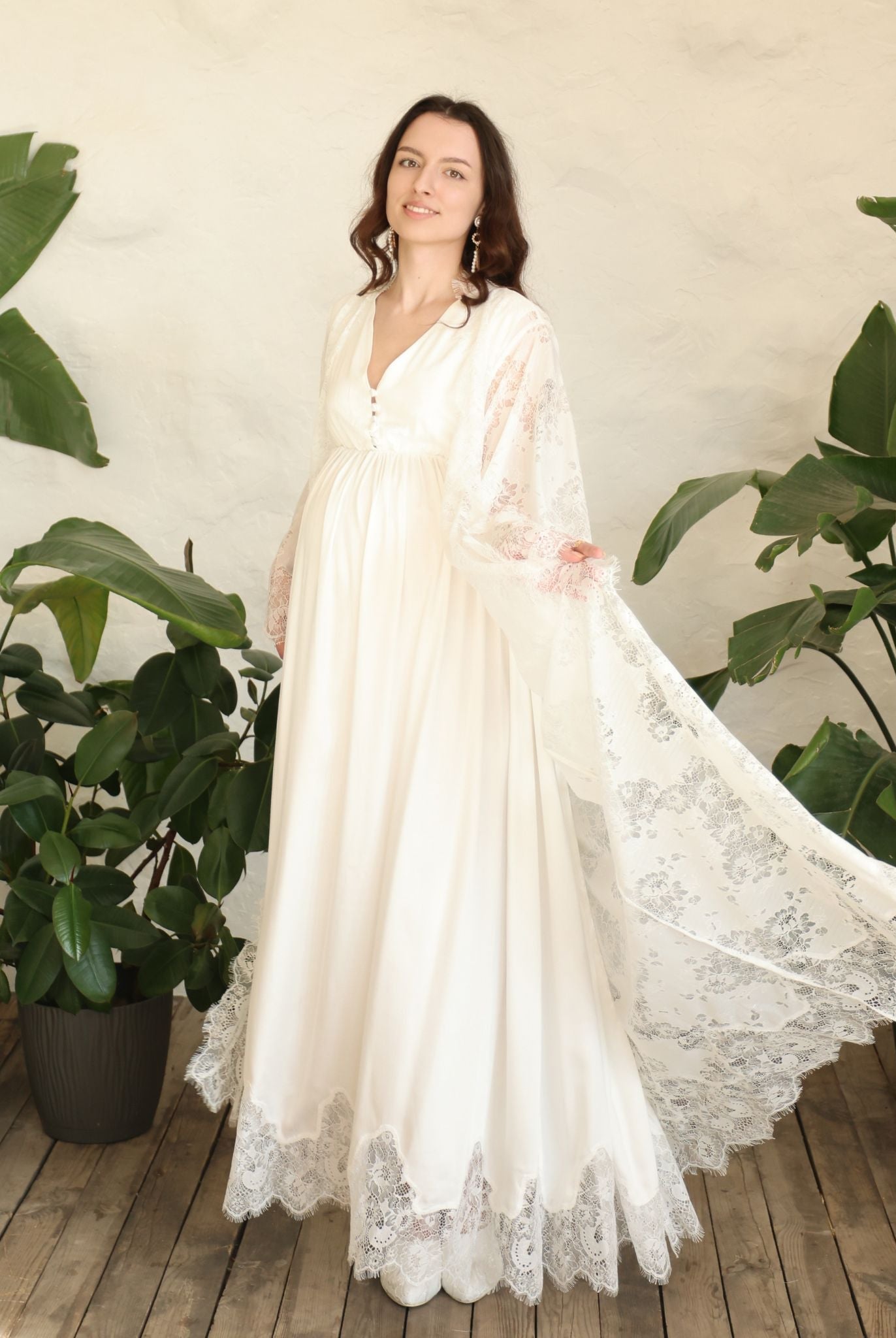 A spirited shot of the flowing lace hem as it twirls, capturing the sense of quiet luxury and effortless grace.