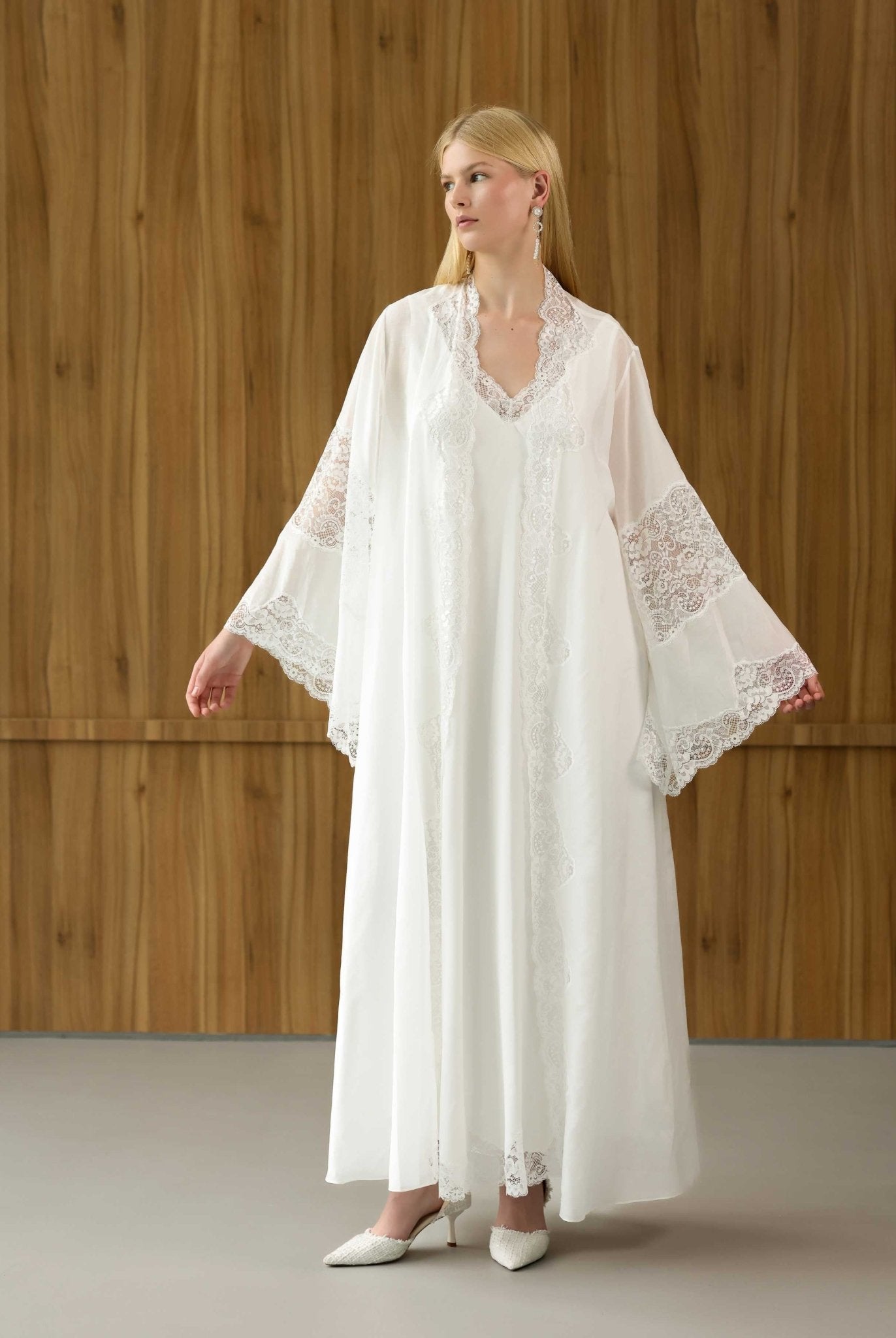 White maternity robe with expansive lace-trimmed sleeves, shown in a front view to highlight the airy silhouette.
