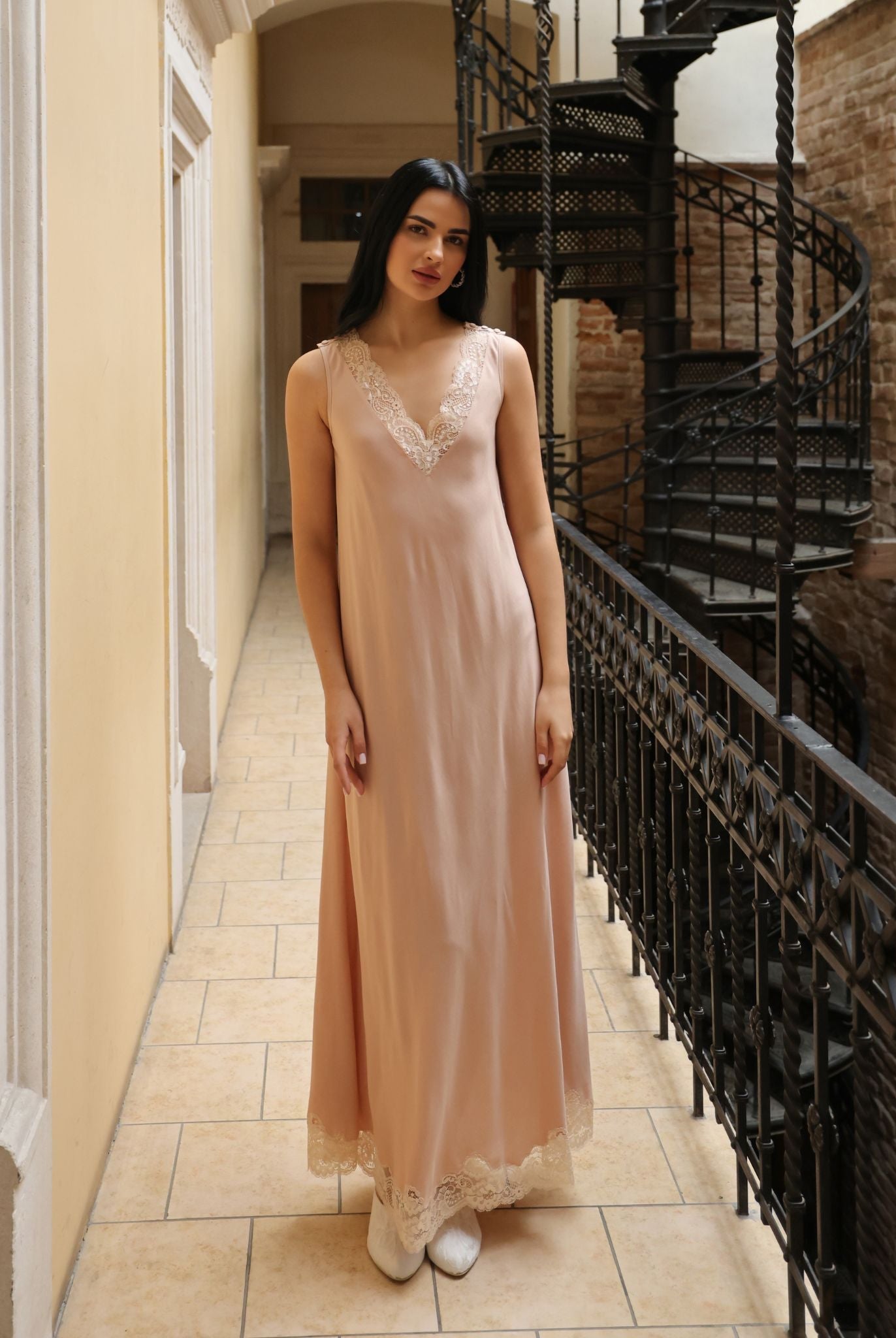 Frontal view of the loose-fitting nightgown, highlighting the elegant lace details and the comfortable, wide silhouette.