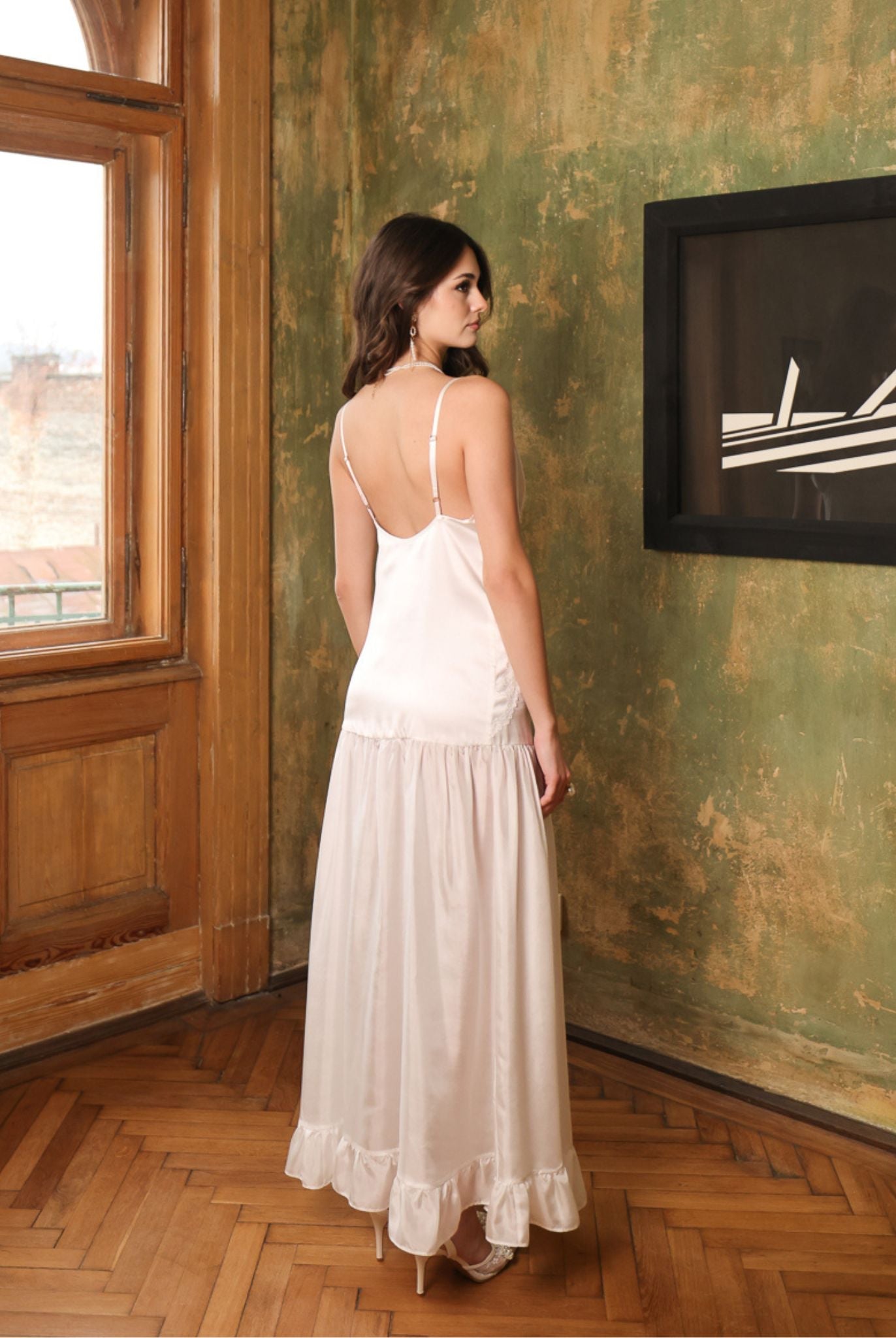 Rear view of the silk satin nightdress, highlighting the elegant princess style cut and the smooth, glossy texture.