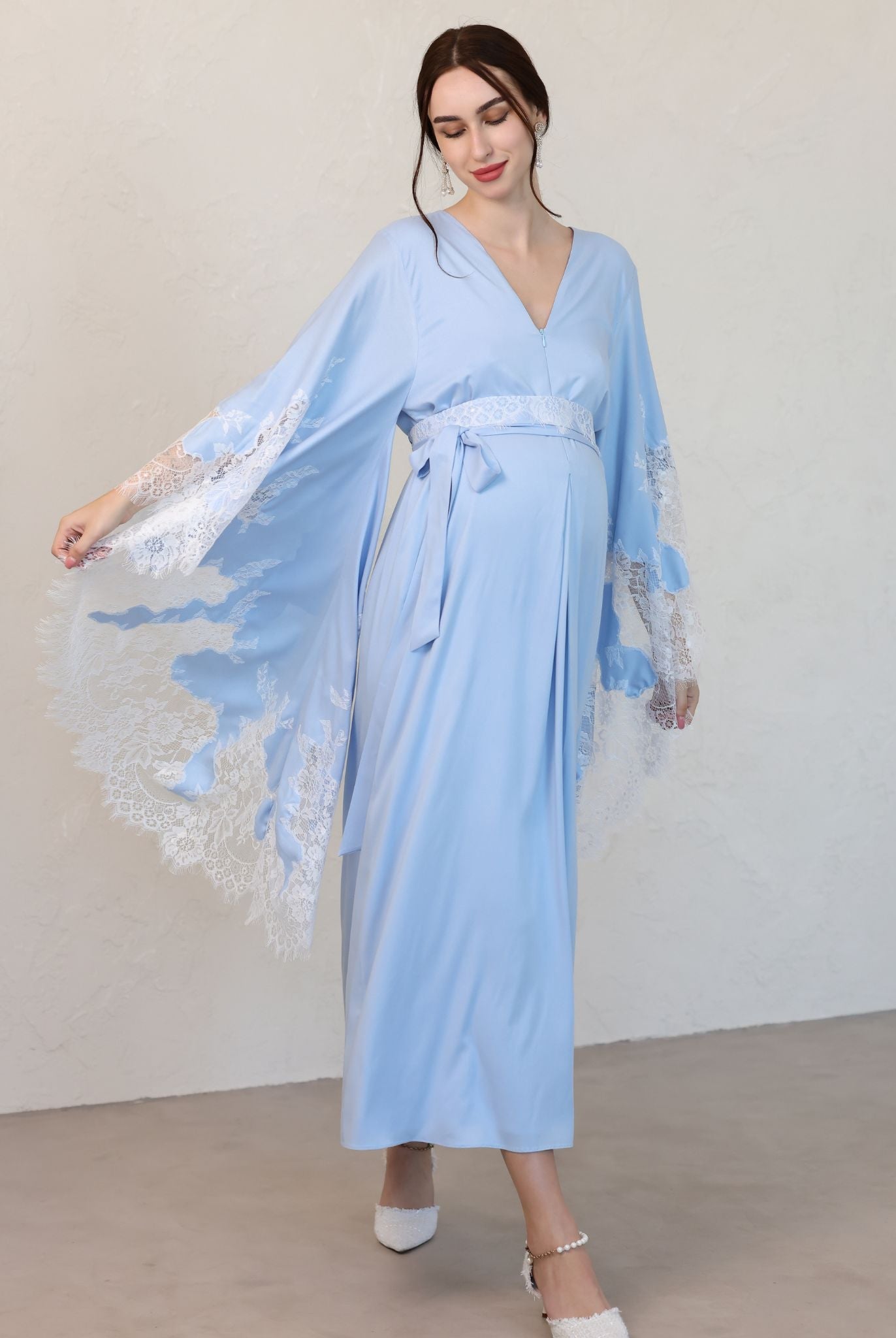 A dynamic shot of the Maternity Kaftan in motion, capturing the airy feel and elegant movement of the natural fabric.