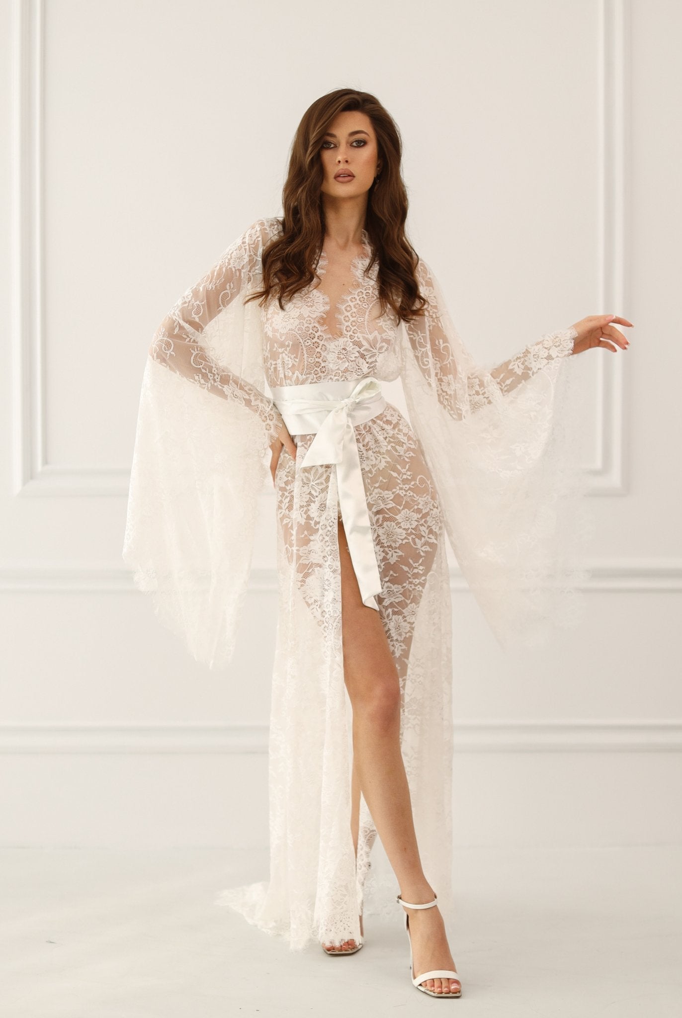 Model wearing ivory lace bridal robe with sheer sleeves and satin sash – Kafemme