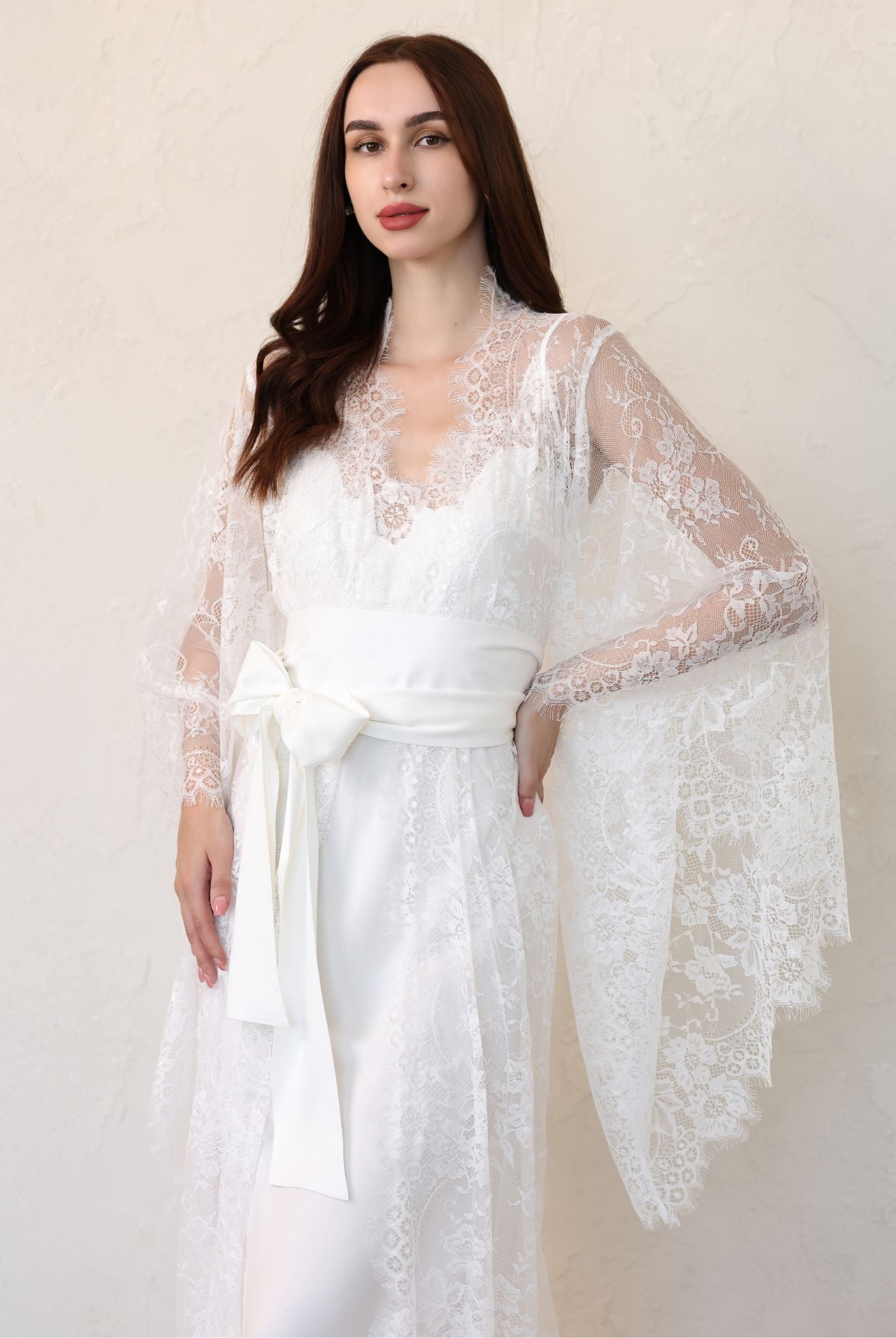 Side view of sheer lace bridal robe with flared sleeves