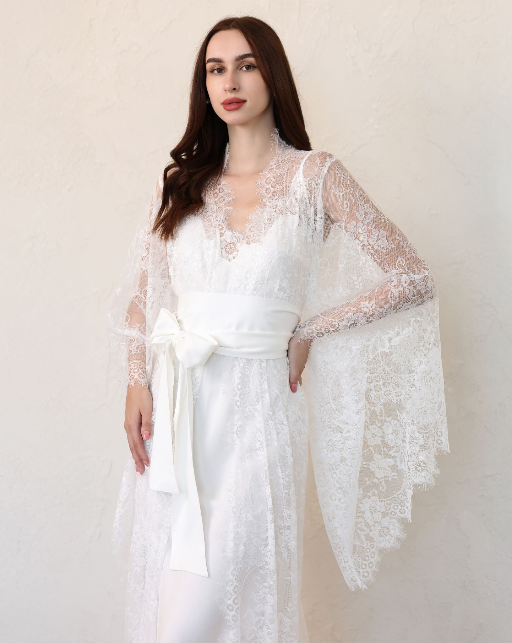 Side view of sheer lace bridal robe with flared sleeves