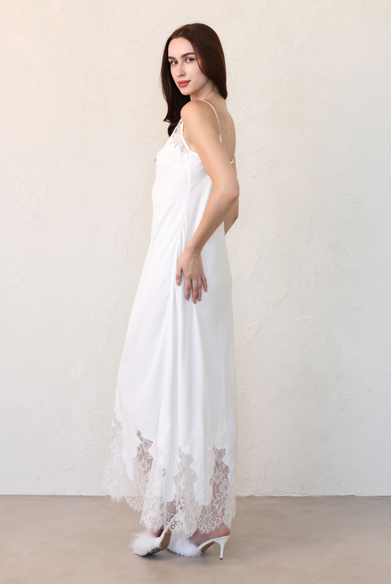 Side view of cotton dress with train and lace accents