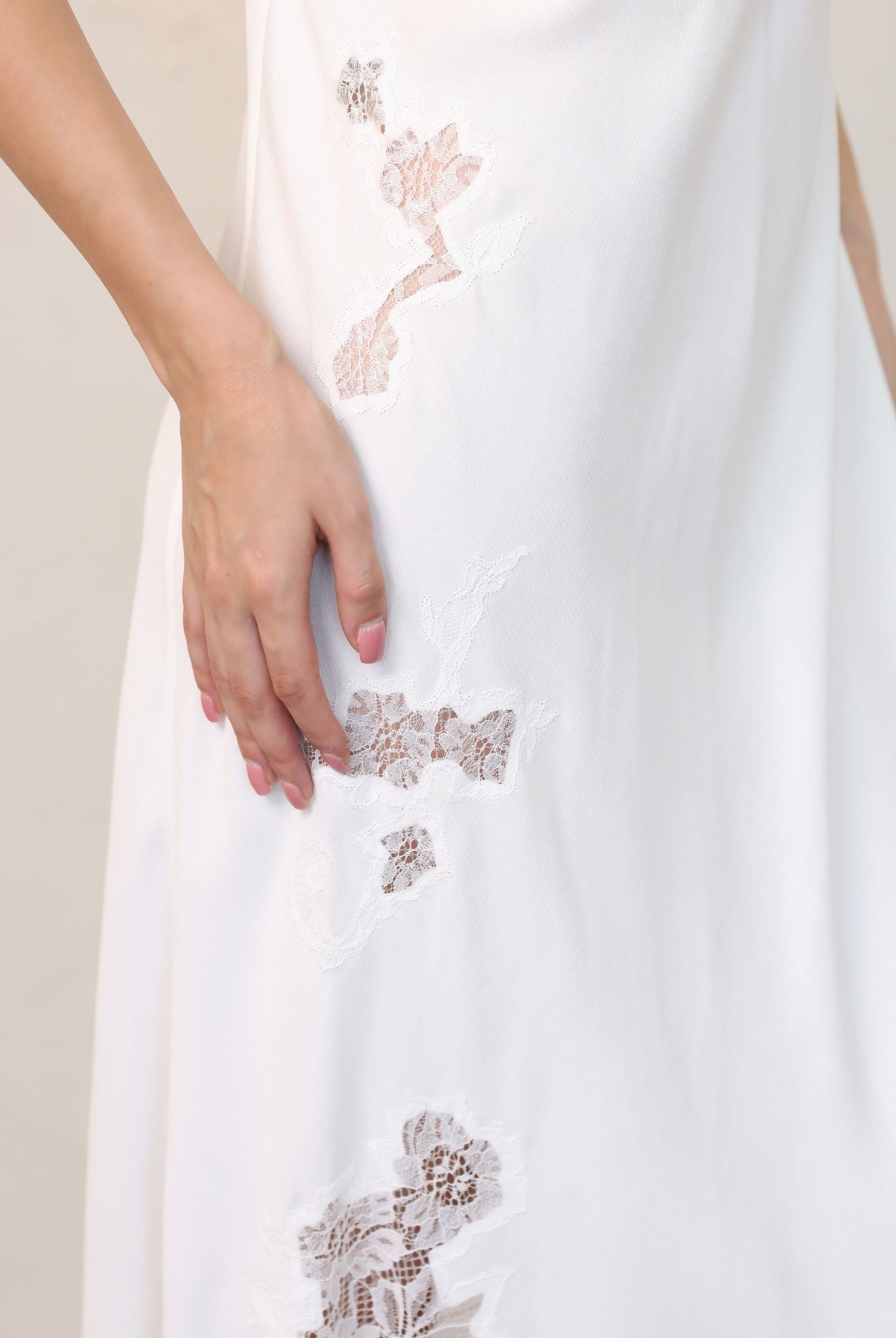 Close-up of embroidered lace detail on bridal nightgown