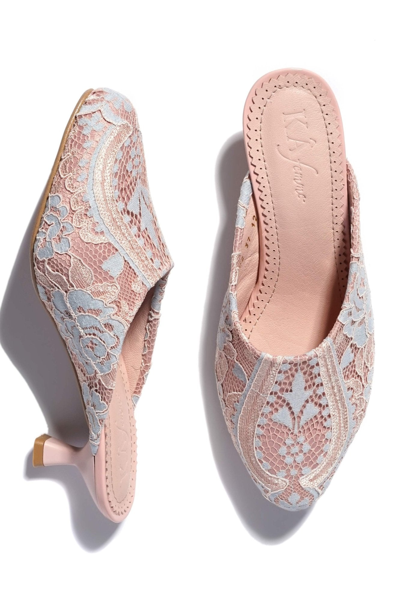 A static studio shot showing one shoe standing on its 5 cm heel and the other lying to highlight the heel form.