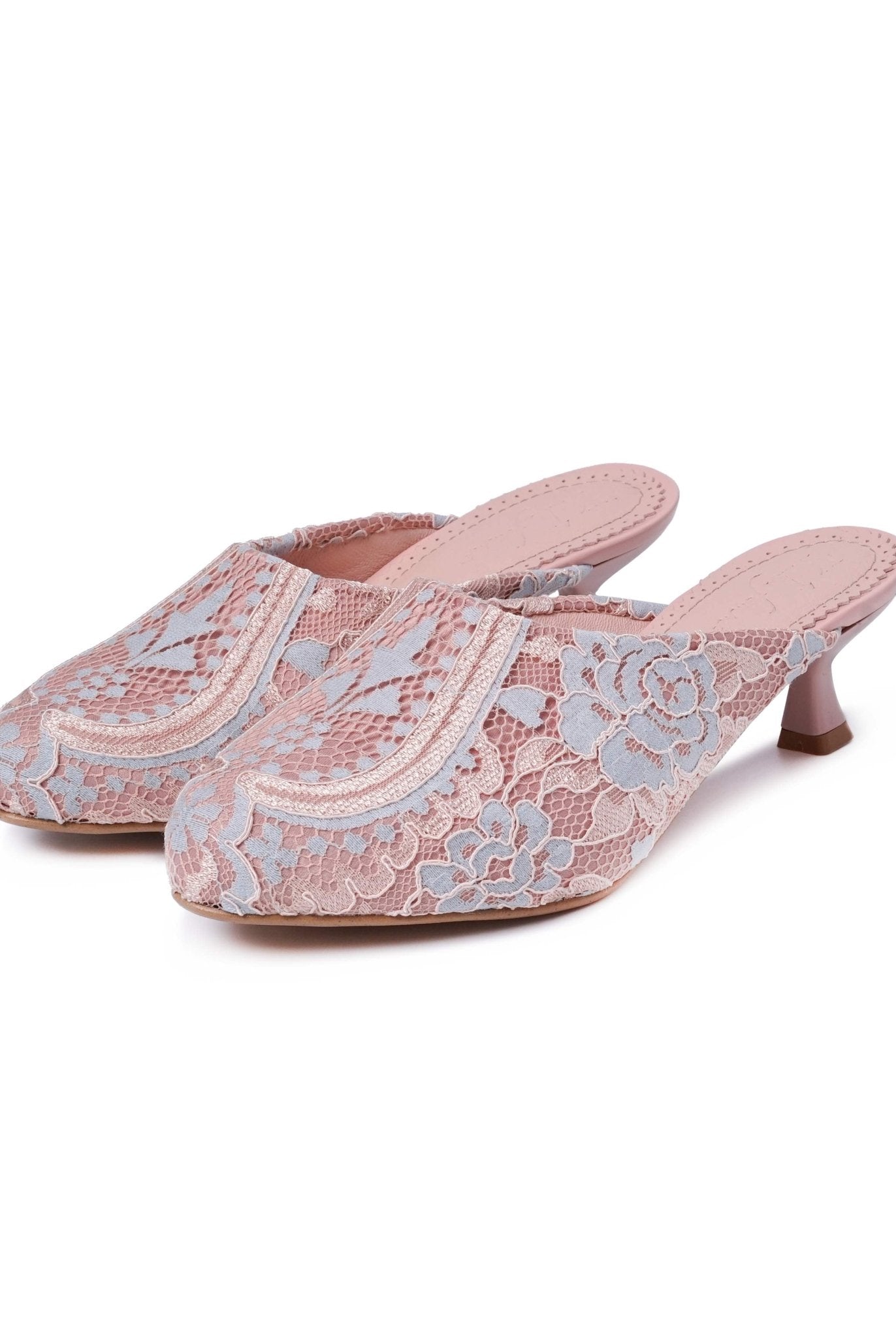 A clear shot of the pair of heeled shoes standing close together on a clean white background.