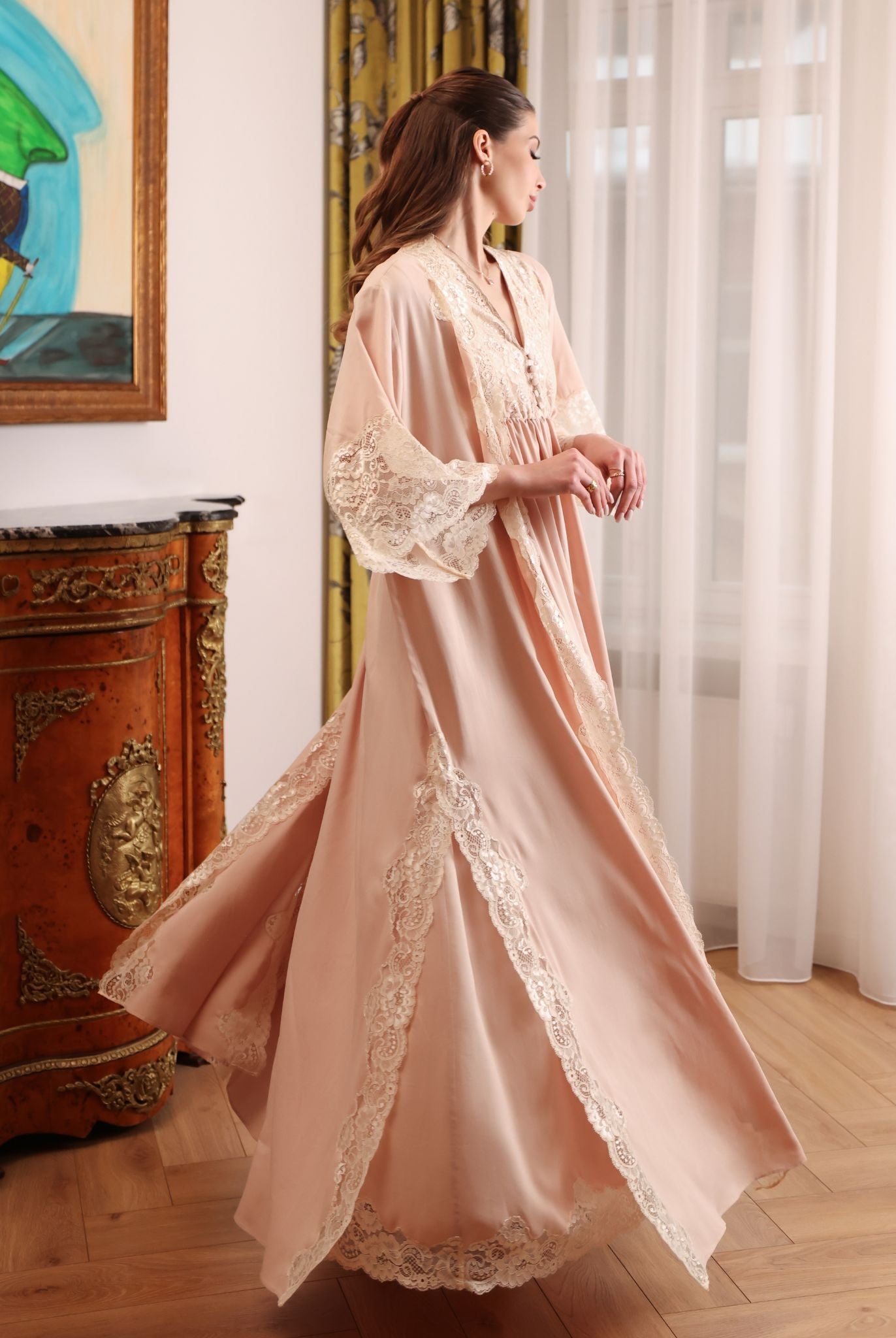 A dynamic turn in the Robe and Nightgown Set, illustrating the reliable duo that understands a new mother's needs.