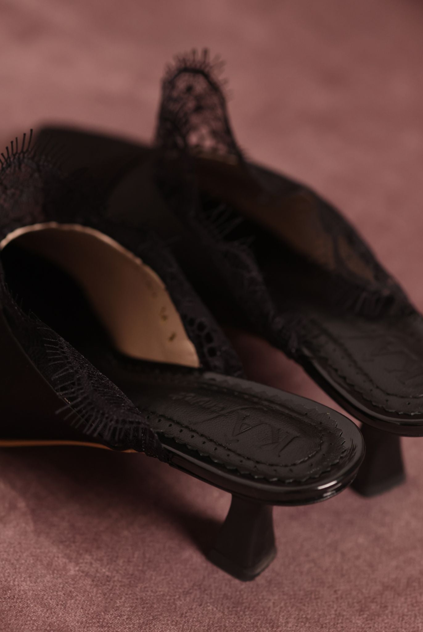 Top view of the Satin Slippers featuring the brand logo on the soft padded genuine leather insole.