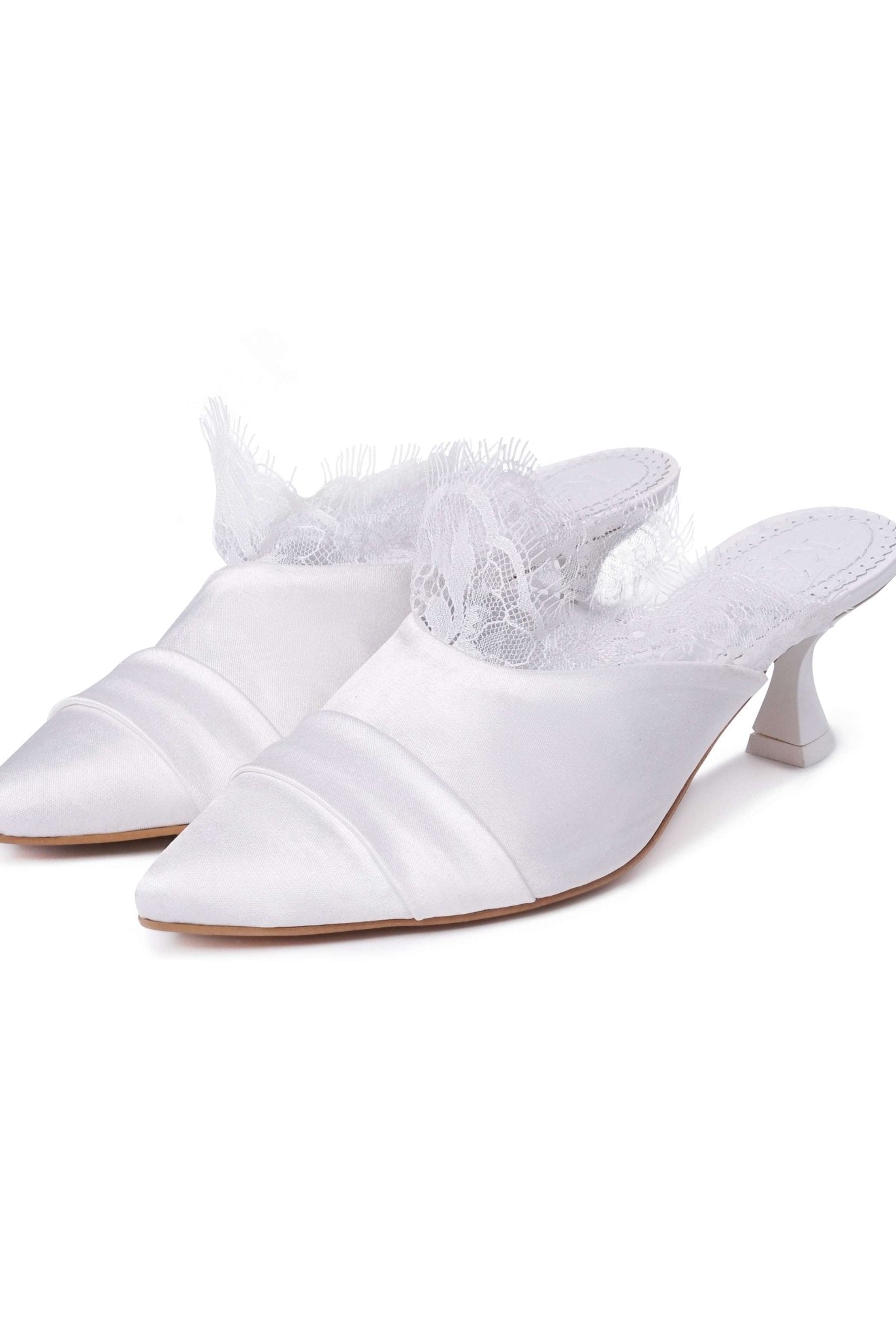 A clear view of two pairs of heeled slippers standing together on a clean white background.