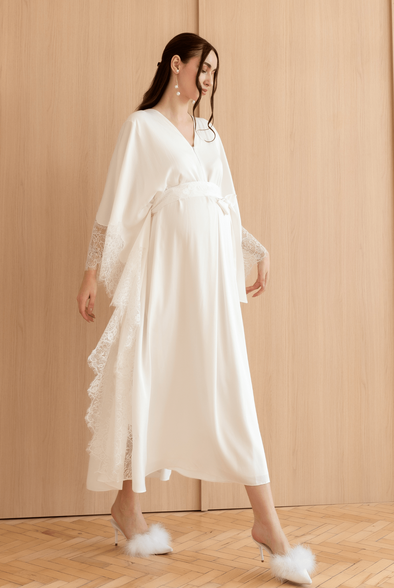 A dynamic walking shot of the Cotton Kaftan, capturing the effortless elegance and movement of the natural material.