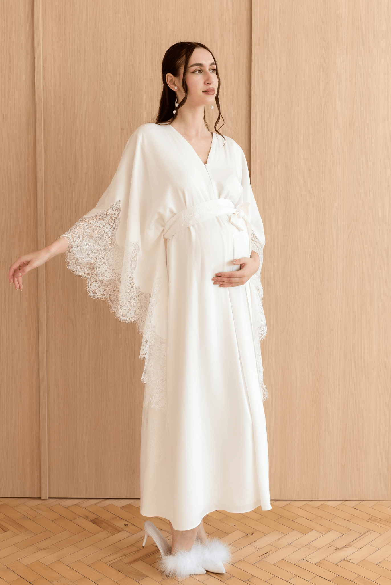 Full-length pose with hands on the belly and raised, illustrating the perfect balance of function and classic style.