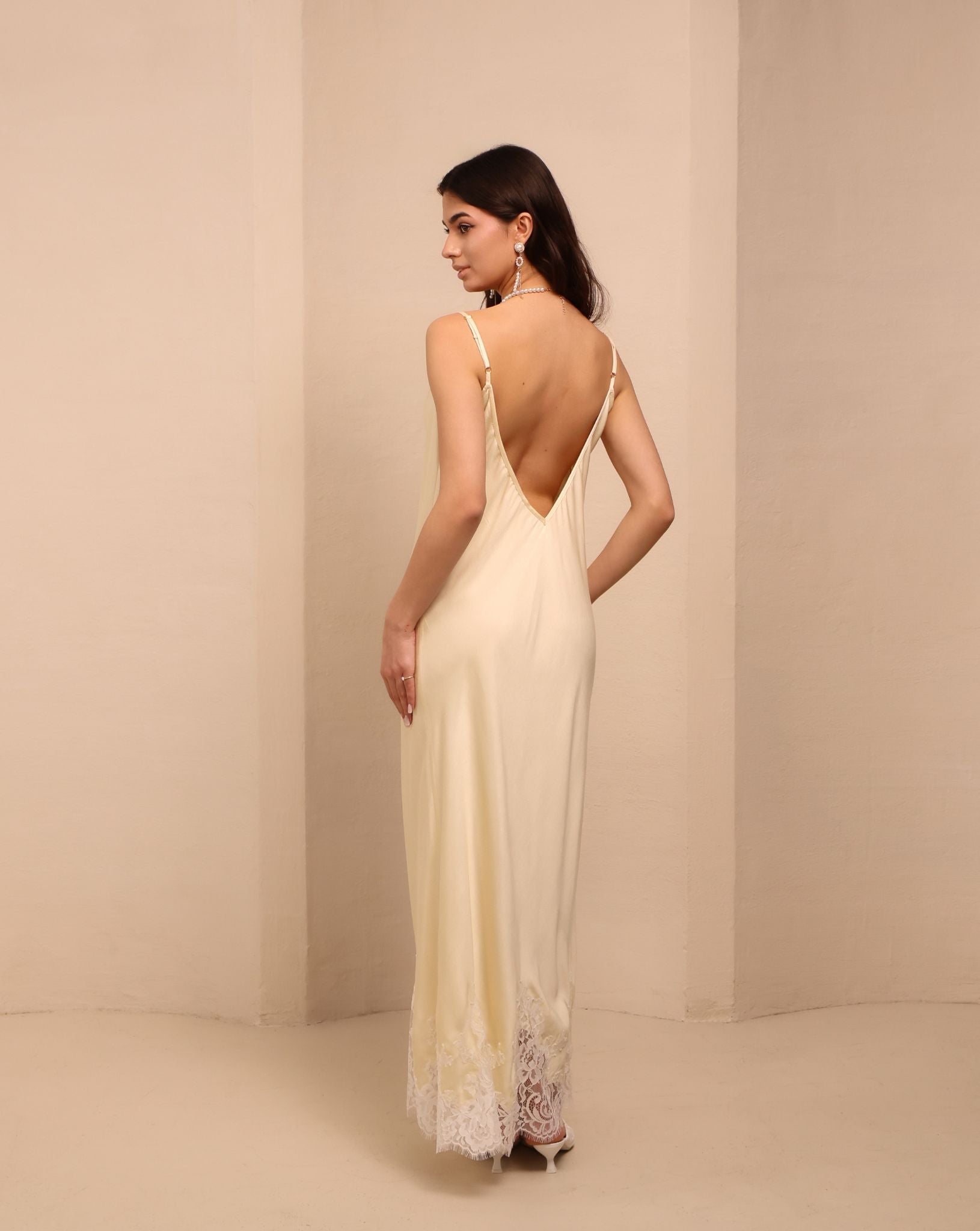 Rear view of the nightgown, highlighting the mid-open V-cut back for an intimate and elegant look.
