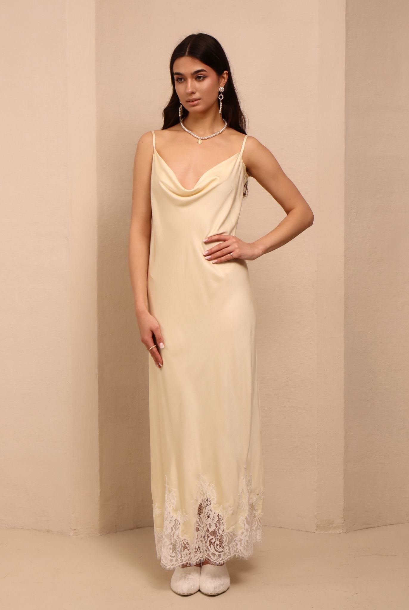 Frontal perspective of the vanilla nightgown, designed to caress the skin with its smooth and light material.