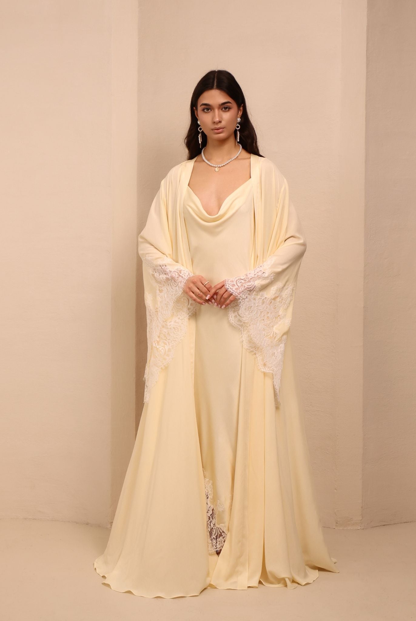 Frontal view of the vanilla ensemble, showcasing the luxurious softness and poetic movement of the fabric.