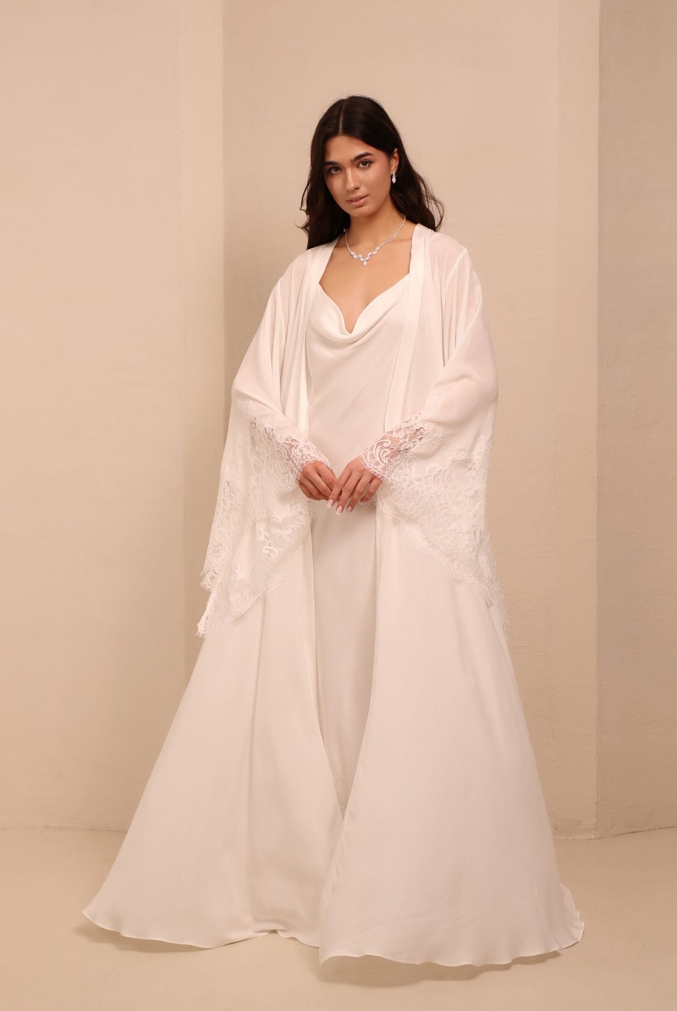 A full-length view of the white Robe and Nightgown Set, capturing its luminous and ethereal silhouette.