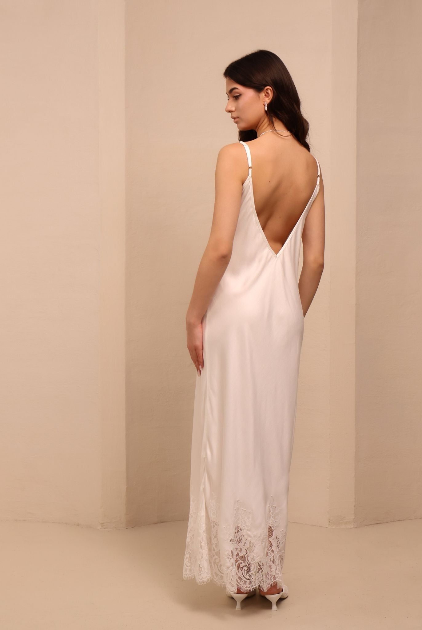 Side shot of the nightdress, showcasing the elegant drape and the beautiful V-cut detail on the back.