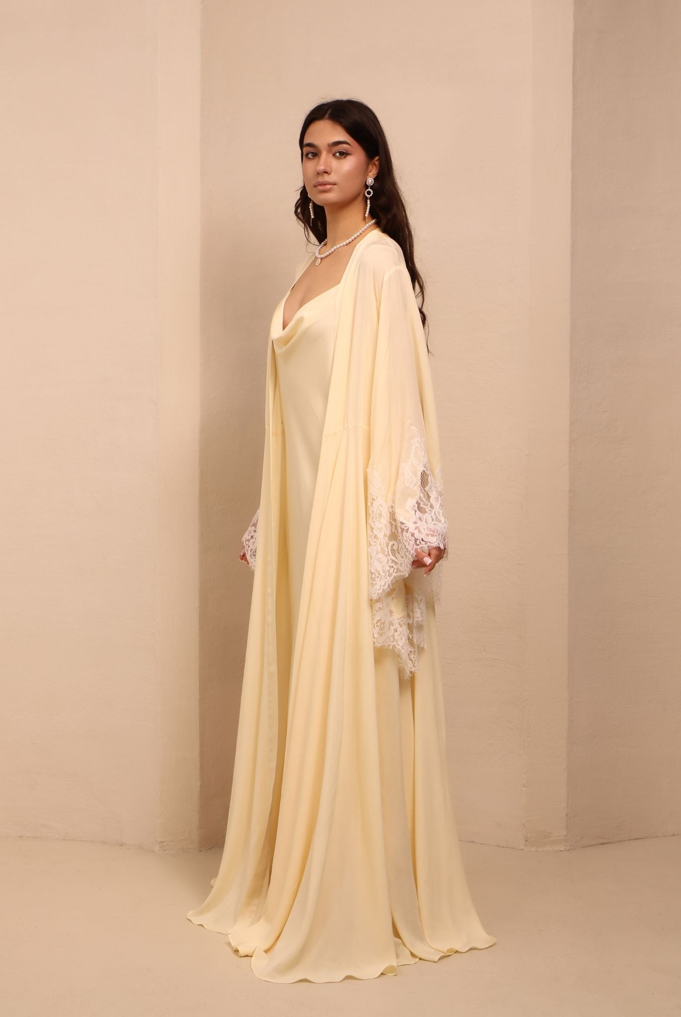 Side perspective of the layered ensemble, highlighting the effortless drape and poetic detail of the robe.
