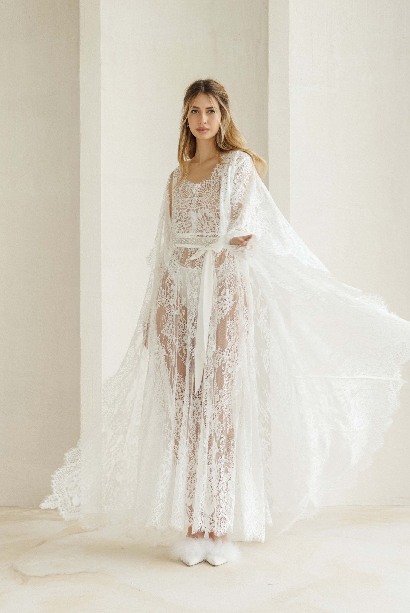 A dynamic view of the Bridal Robe set in motion, capturing how the long hemline flows beautifully as you walk.