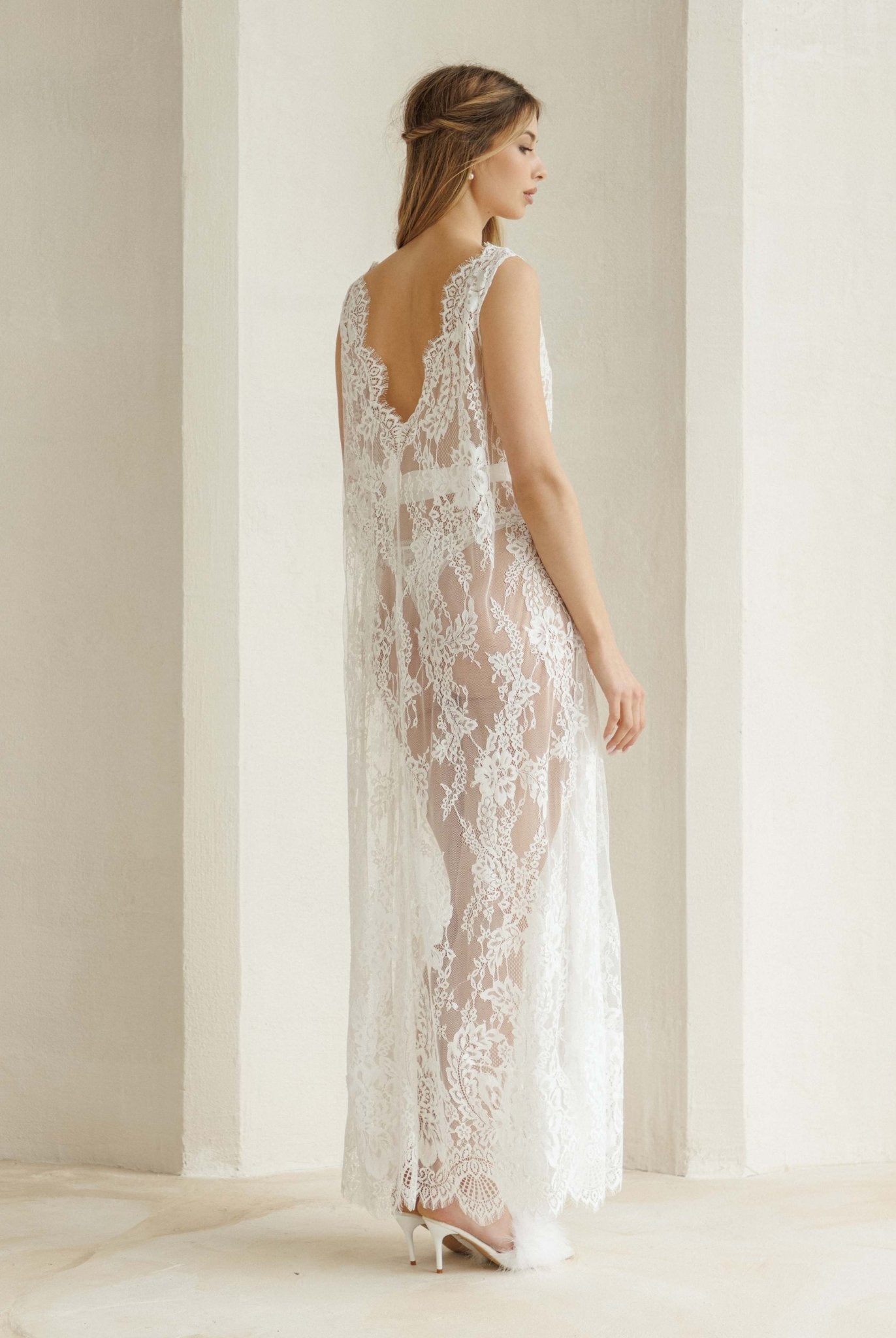 Rear view of the nightdress showcasing the open V-cut back and the intricate beauty of the lace fabric.