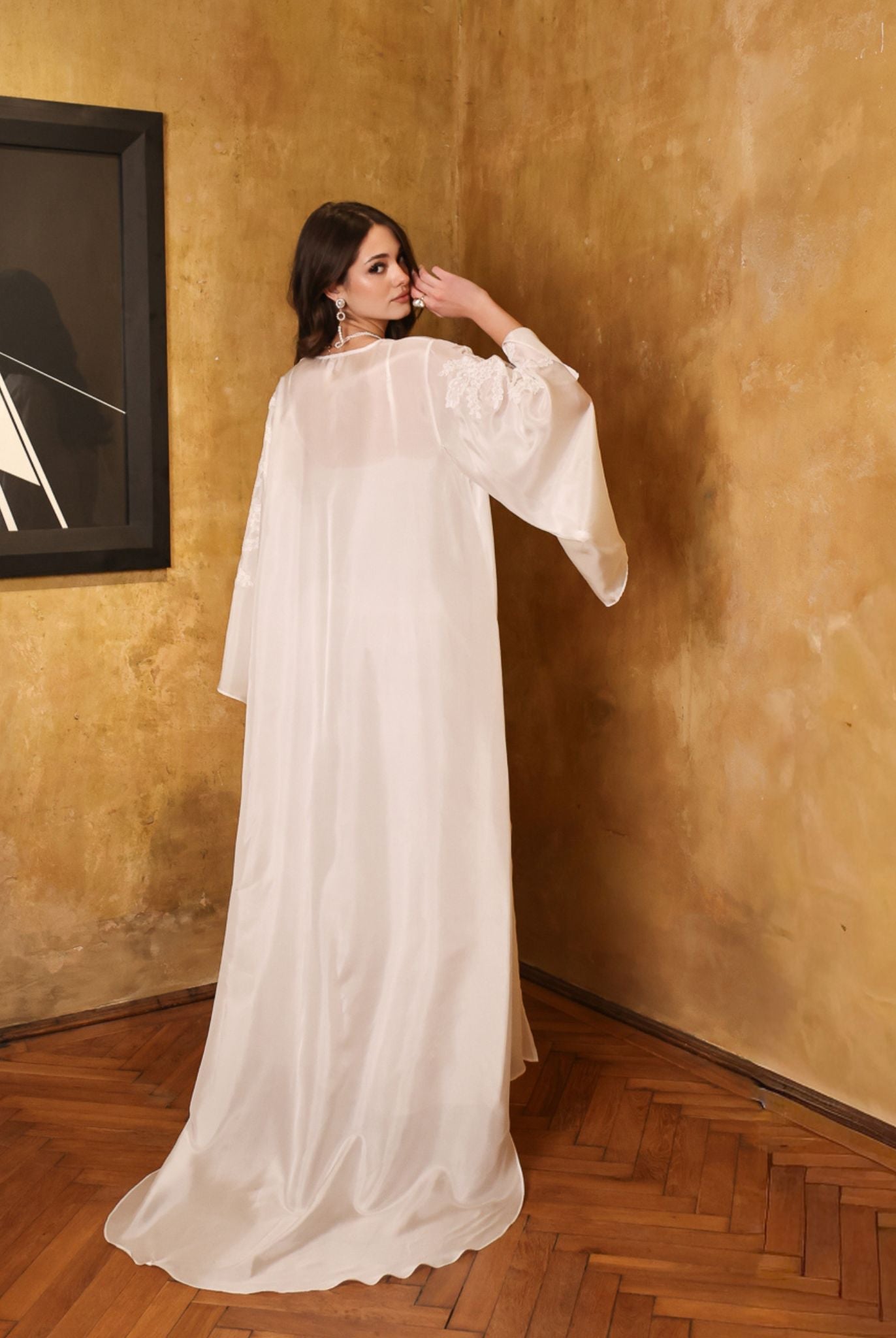 Rear view of the sheer silk chiffon robe, emphasizing the beautiful long train and weightless, airy movement.