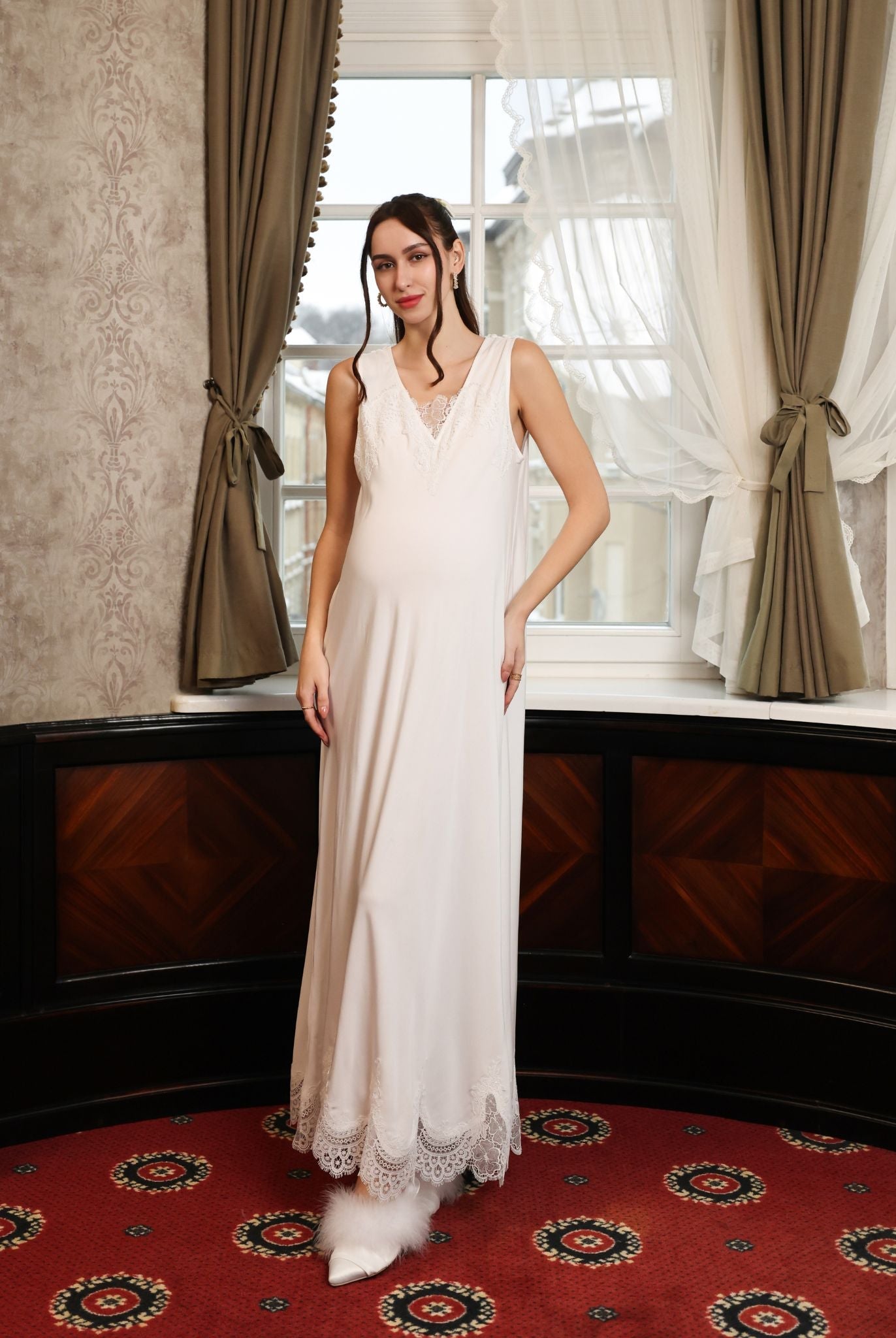 Frontal view of the sleeveless nightgown, featuring delicate lace along the neckline for a romantic finish.