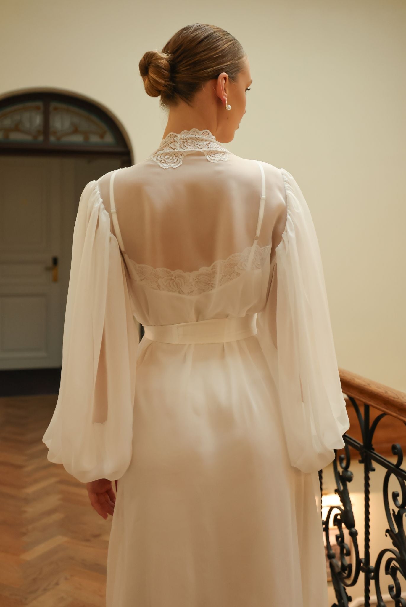 Detailed rear view from head to knees, focusing on the sophisticated back design and the ethereal texture of the sheer silk.