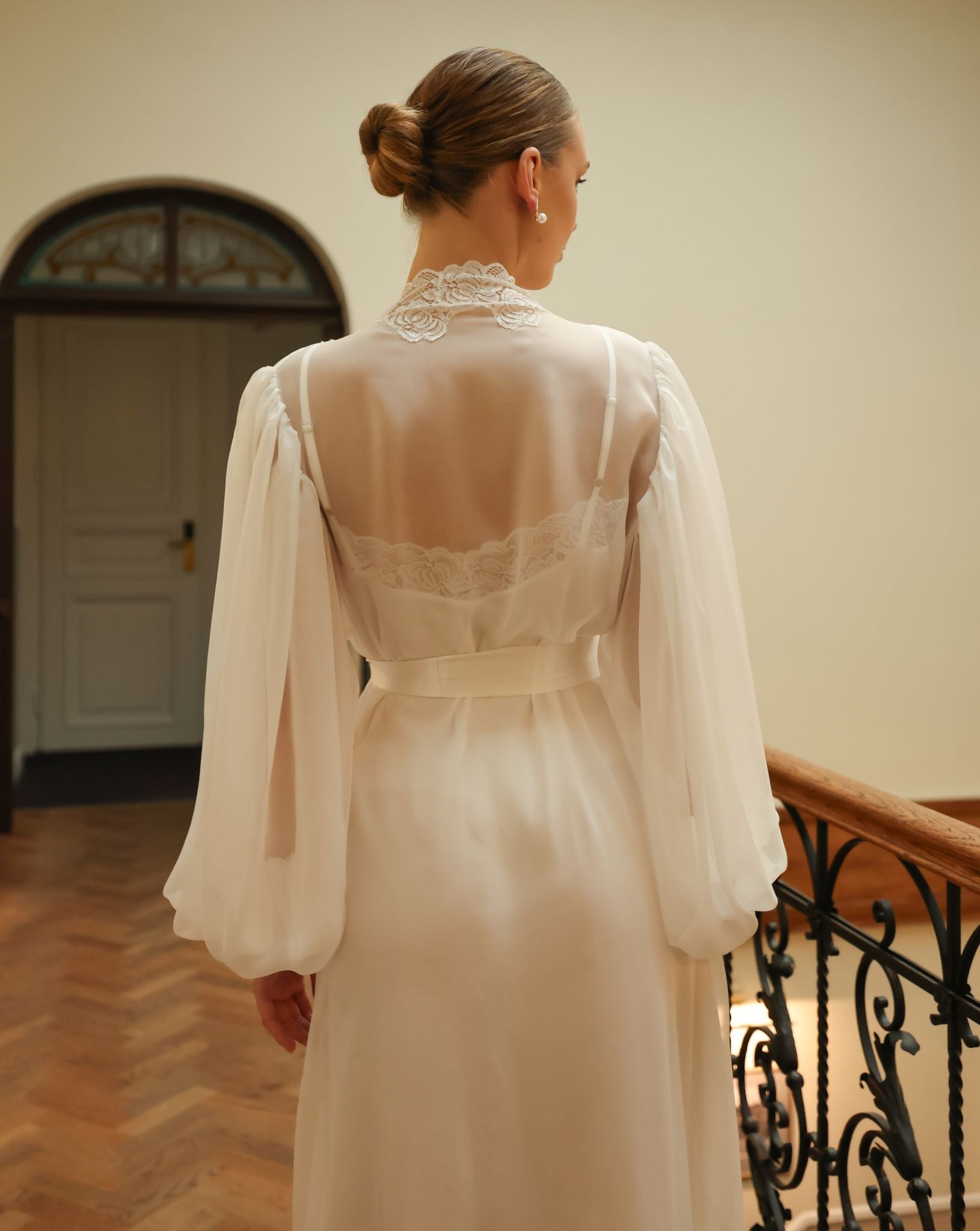 Detailed rear view from head to knees, focusing on the sophisticated back design and the ethereal texture of the sheer silk.