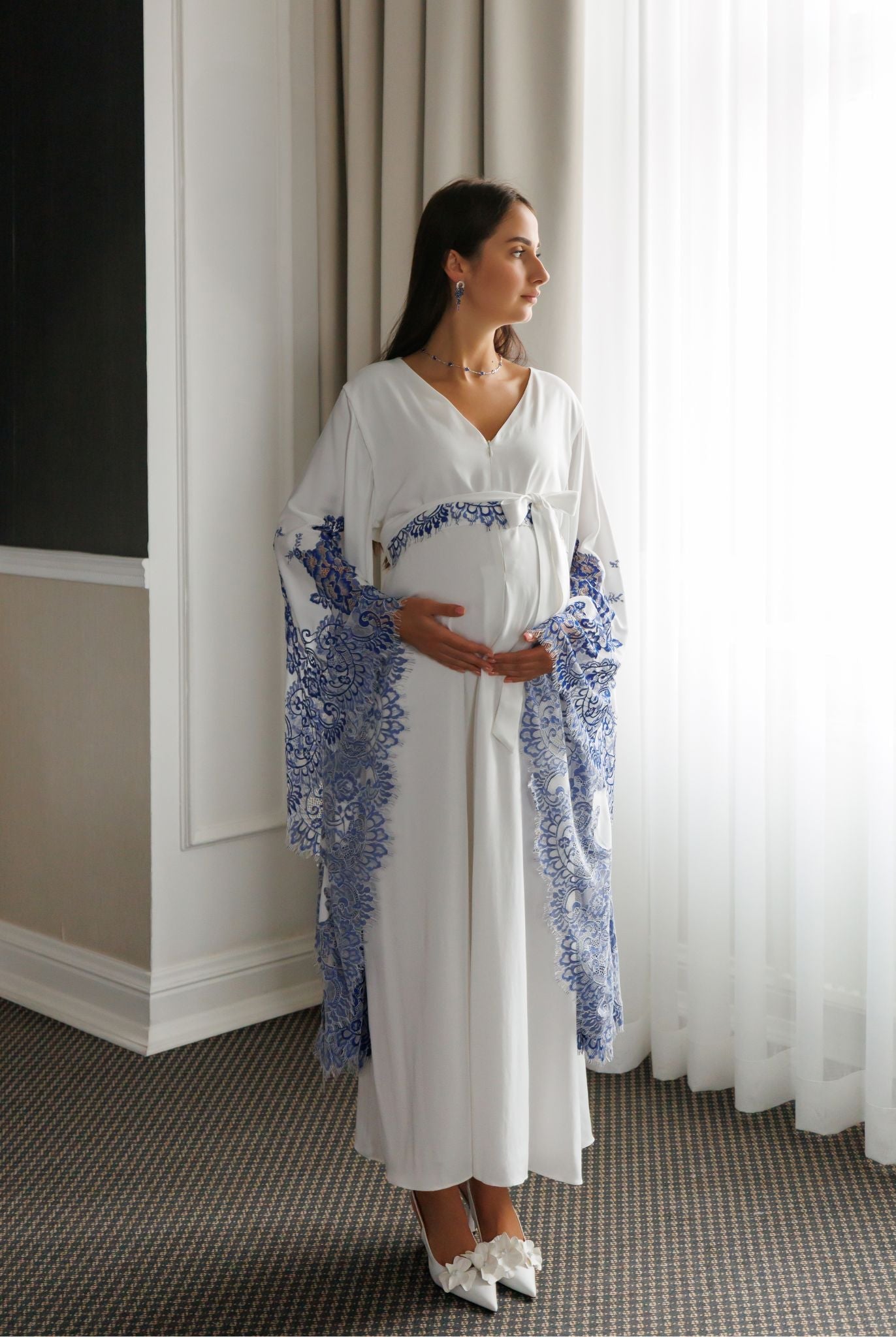 Front view of the maternity attire with a belt, highlighting the versatile design and discreet nursing access.