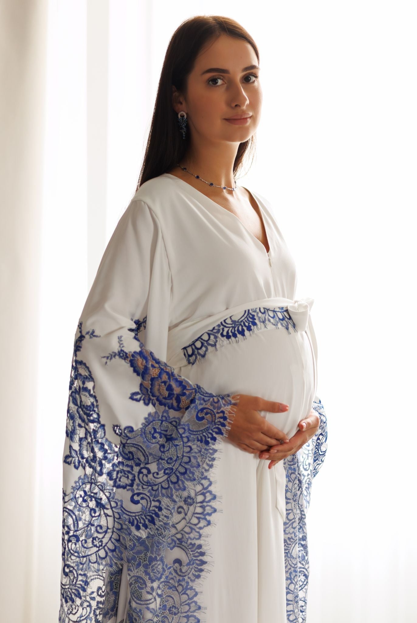 A side profile shot of a Maternity Kaftan from head to knees, featuring a loose fit for pregnancy comfort.