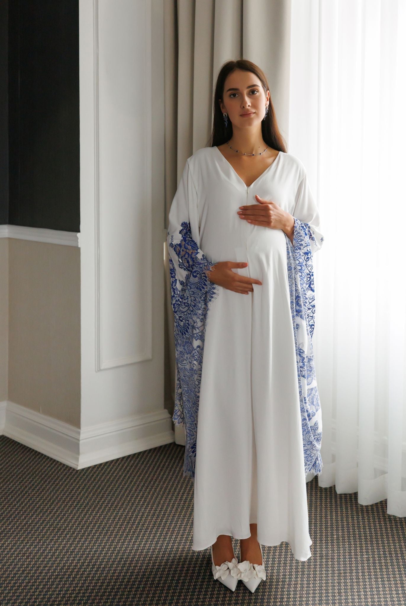 Full-length standing view of the Maternity Kaftan, illustrating its graceful silhouette and weightless feel.
