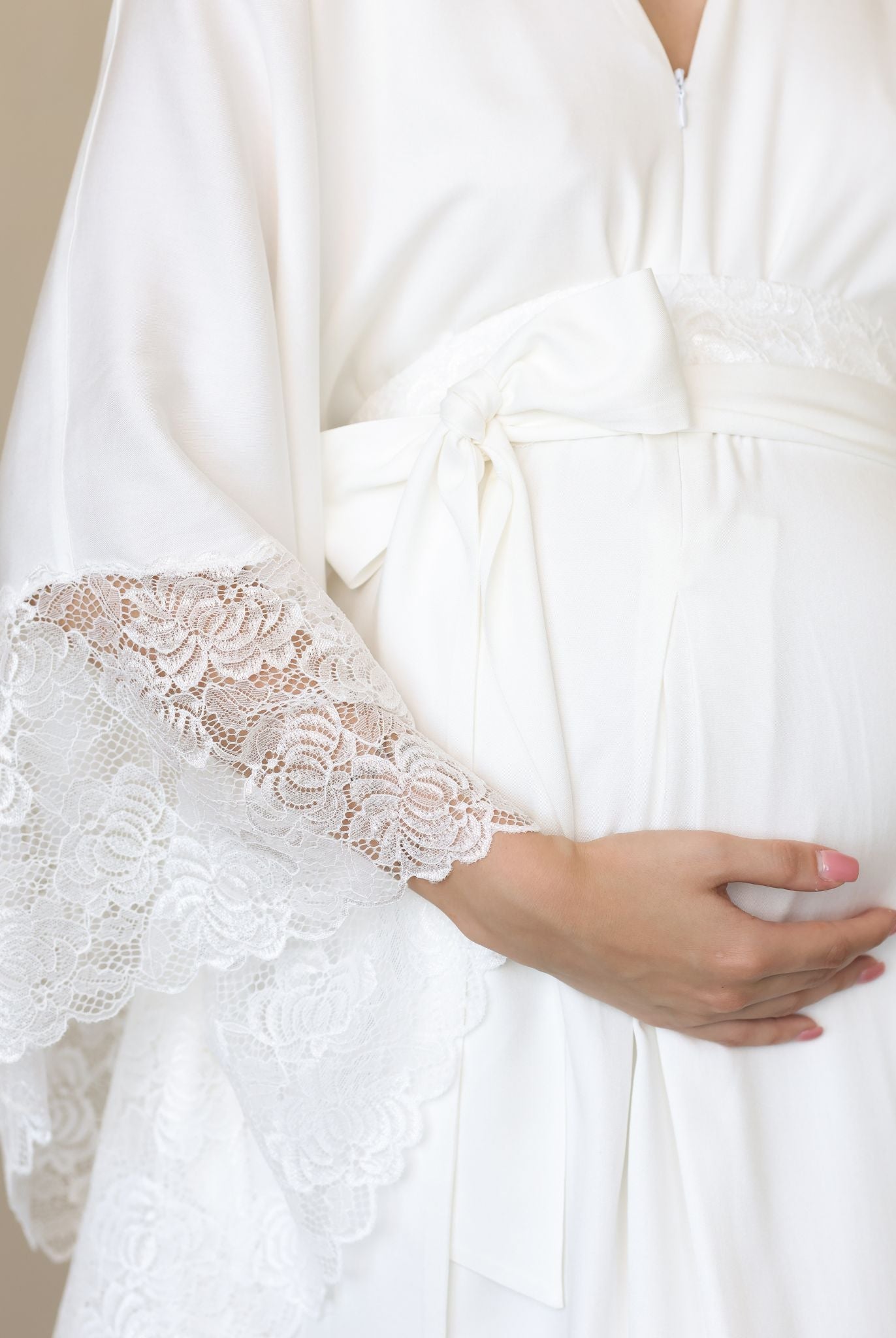 Bridal robe featuring dramatic lace wings and a satin tie for graceful flair.