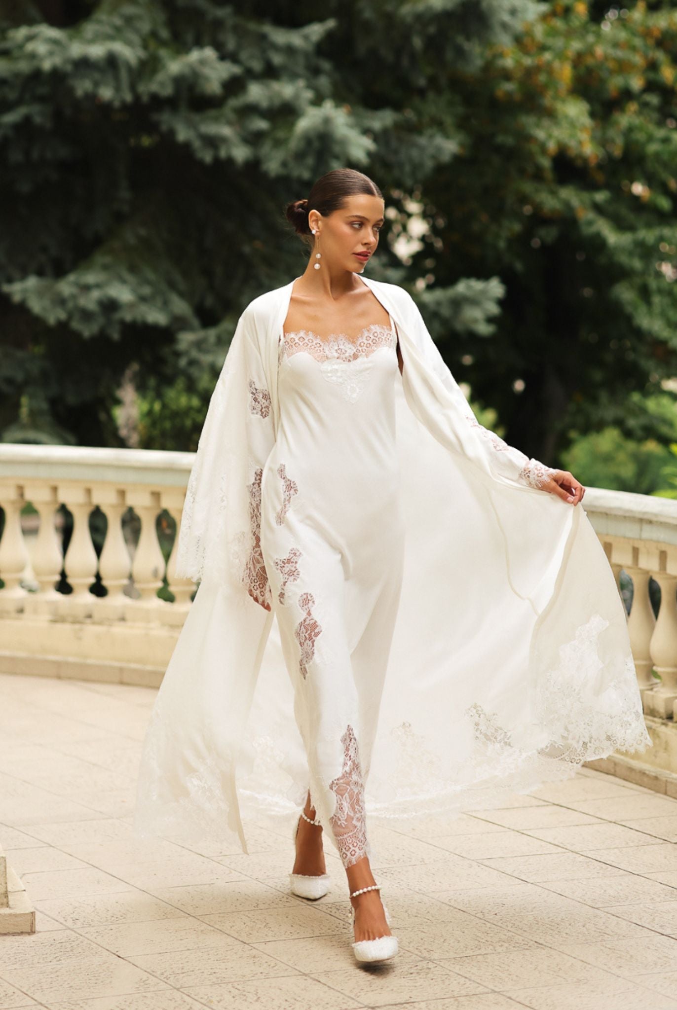 A flowing Robe and Nightgown Set in motion, showcasing the graceful drape and exquisite lace detailing of the cotton.
