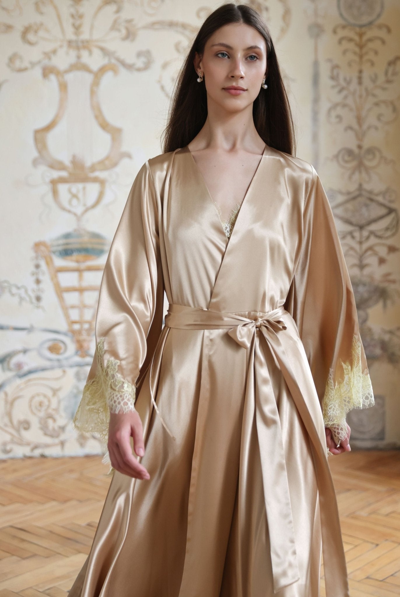 Mid-length view of a woman walking in a satin ensemble, highlighting the smooth texture and light feel.