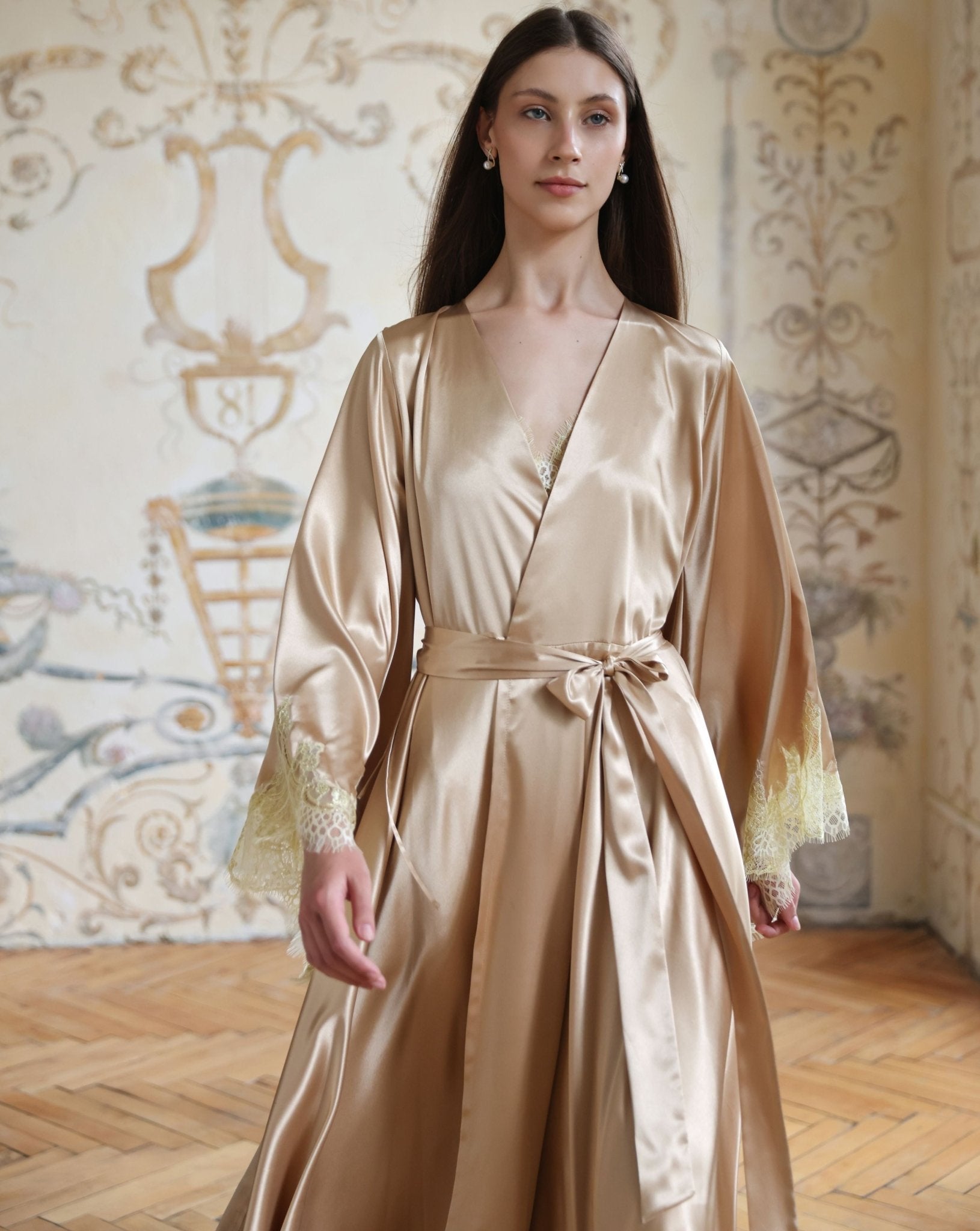 Mid-length view of a woman walking in a satin ensemble, highlighting the smooth texture and light feel.