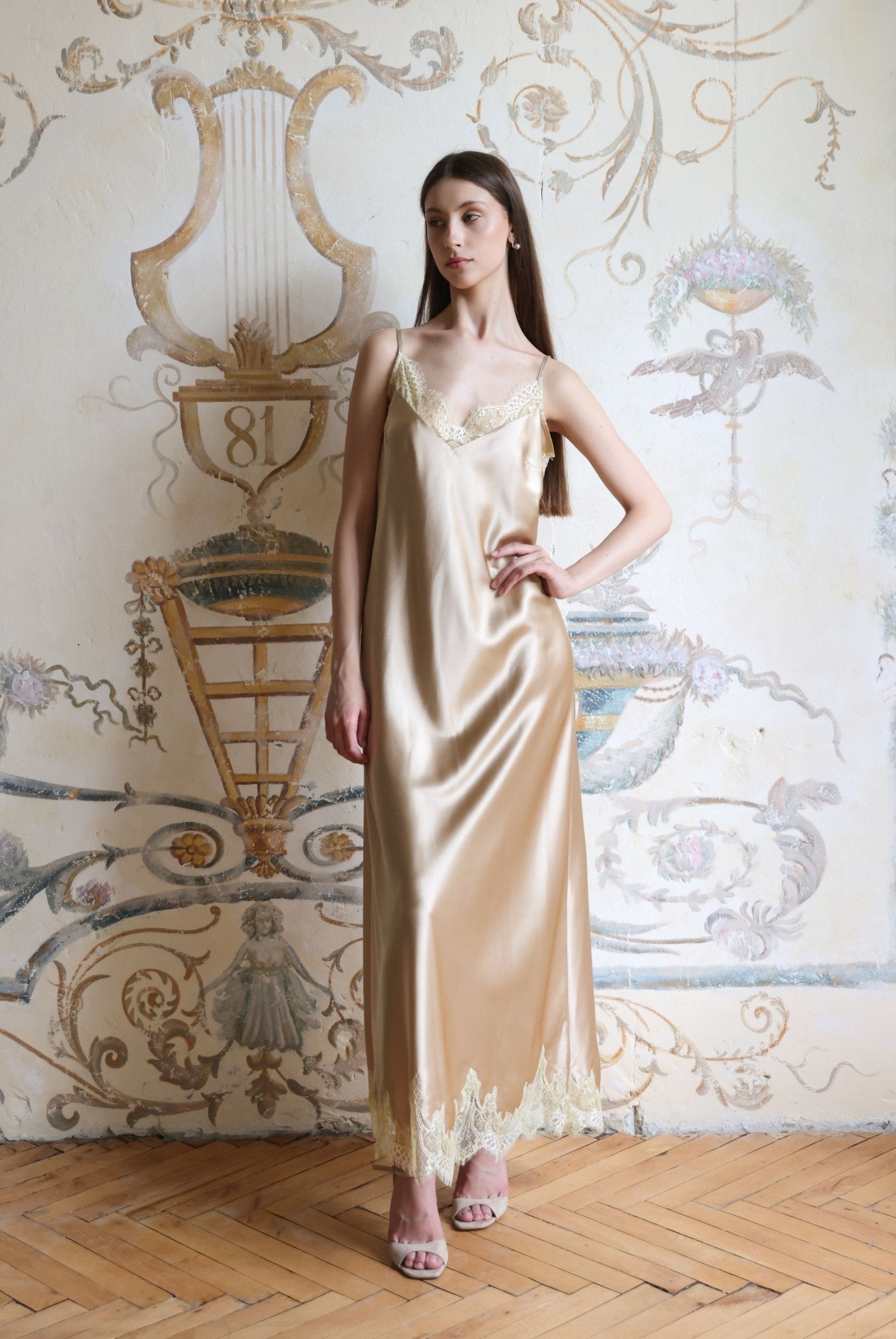 Full-length view of the sleeveless nightgown, highlighting the graceful silhouette that falls just above the ankles.