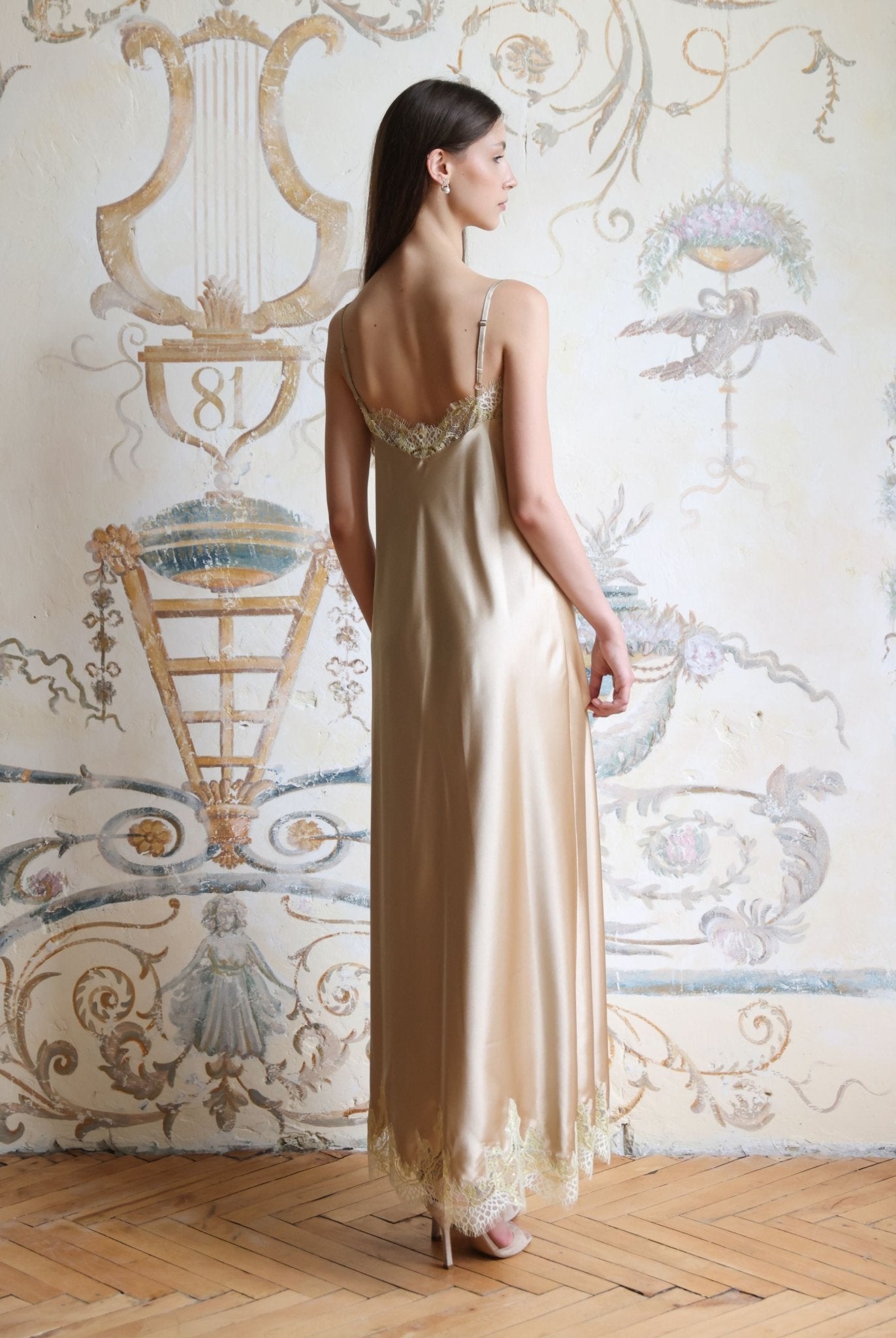 Rear view of the nightgown featuring a mid-open V-cut back and adjustable shoulder straps for a perfect fit.