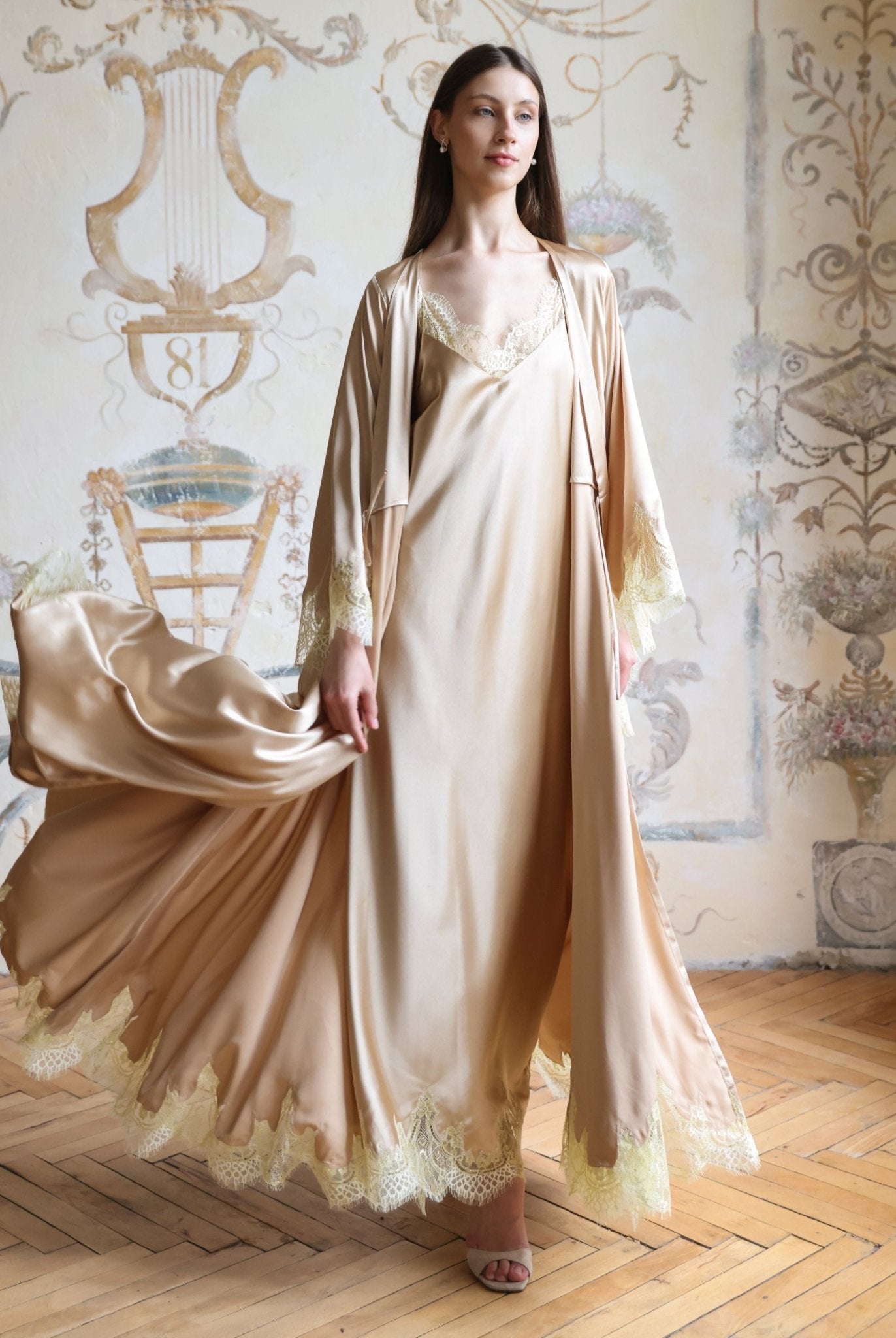 Frontal pose with a lifted robe hem, emphasizing the breathable fit and the consistent lace-trimmed design.