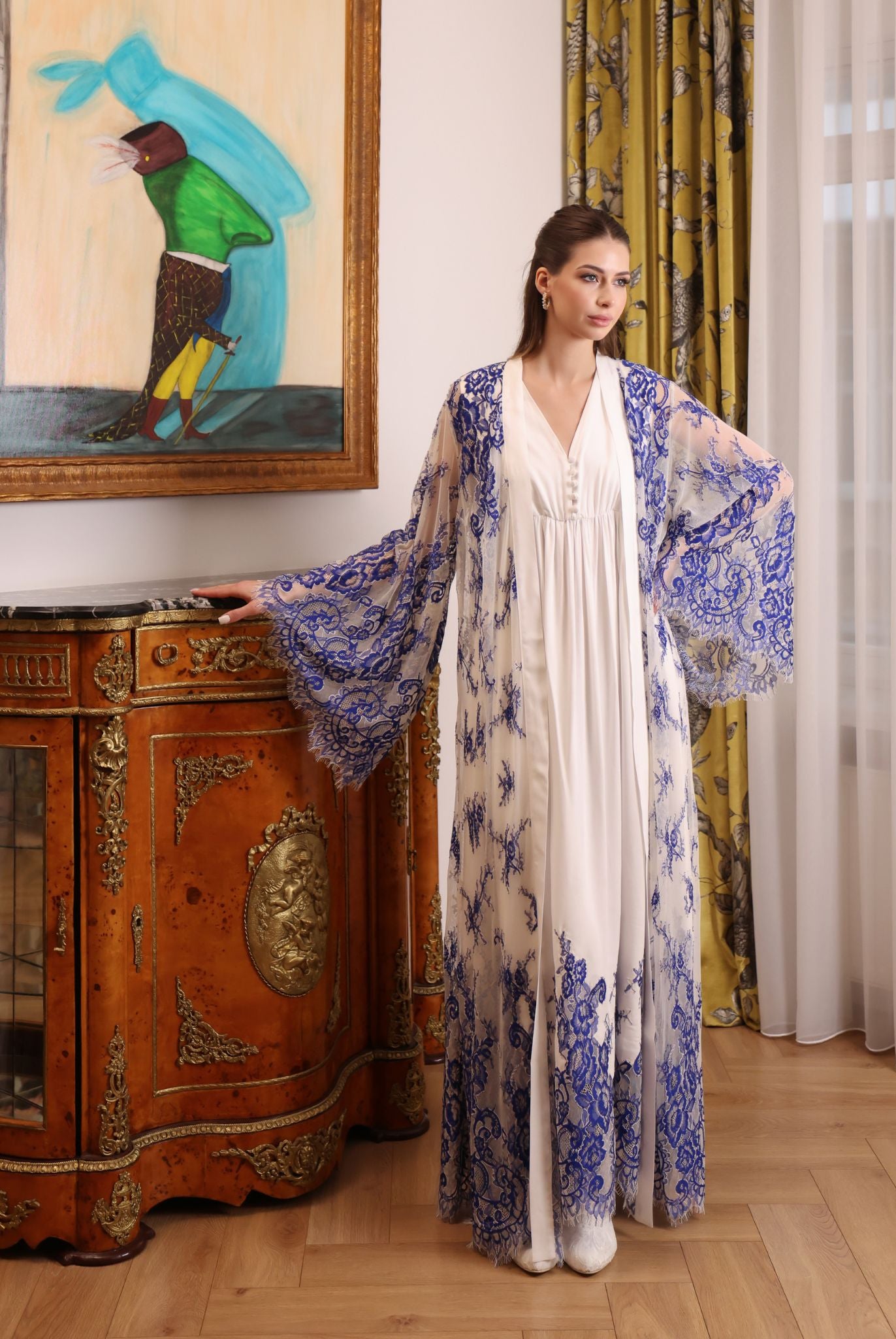 Mid-length view of the tied lace robe over the cotton dress, highlighting the supportive and feminine fit.