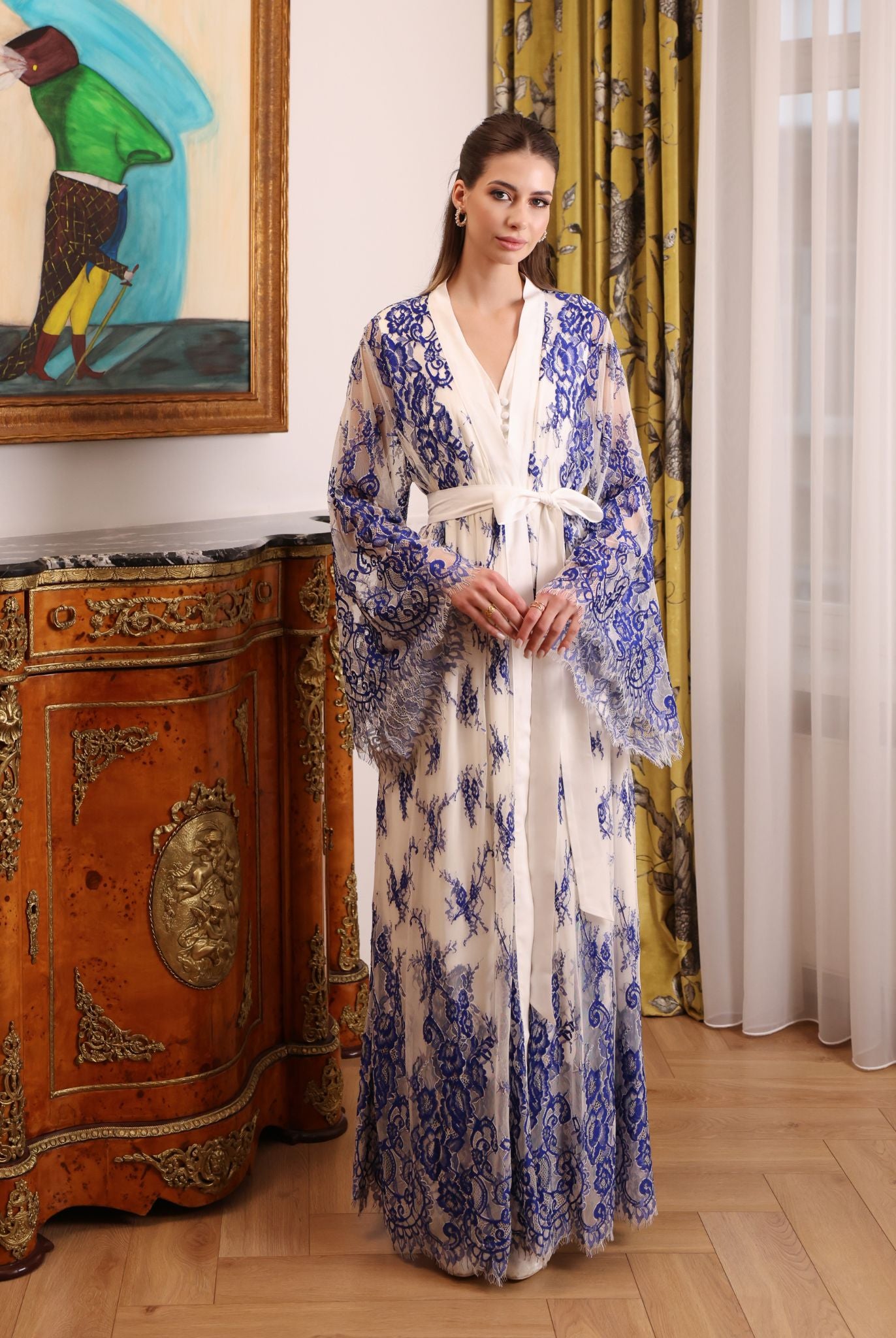 Mid-length view of the tied lace robe over the cotton dress, highlighting the supportive and feminine fit.