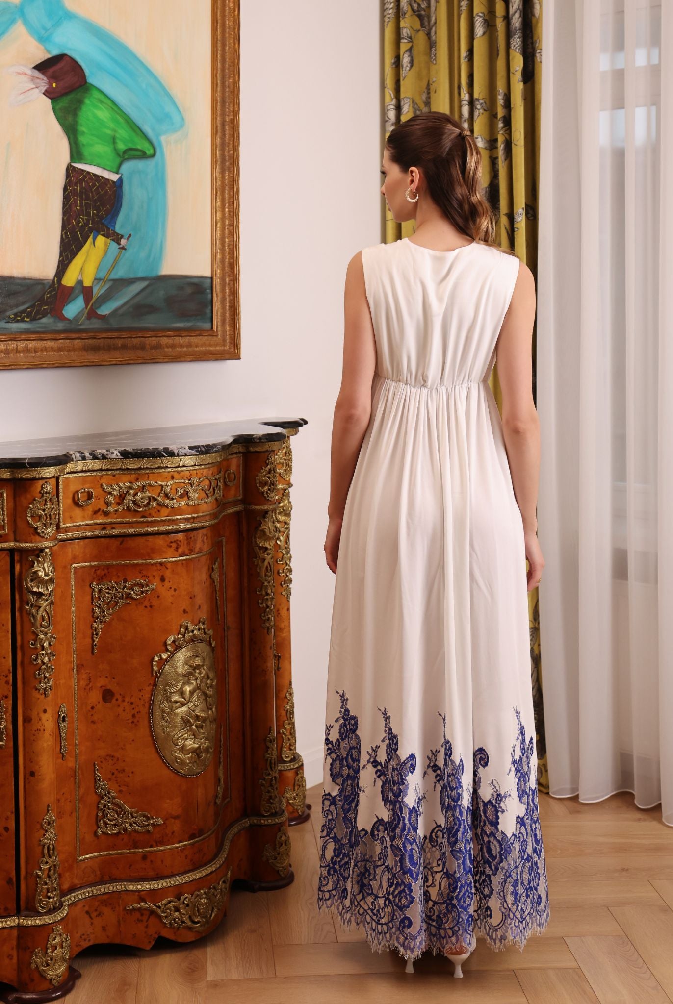 Rear perspective of the maternity nightgown, highlighting the smooth drape and clean, elongated silhouette.