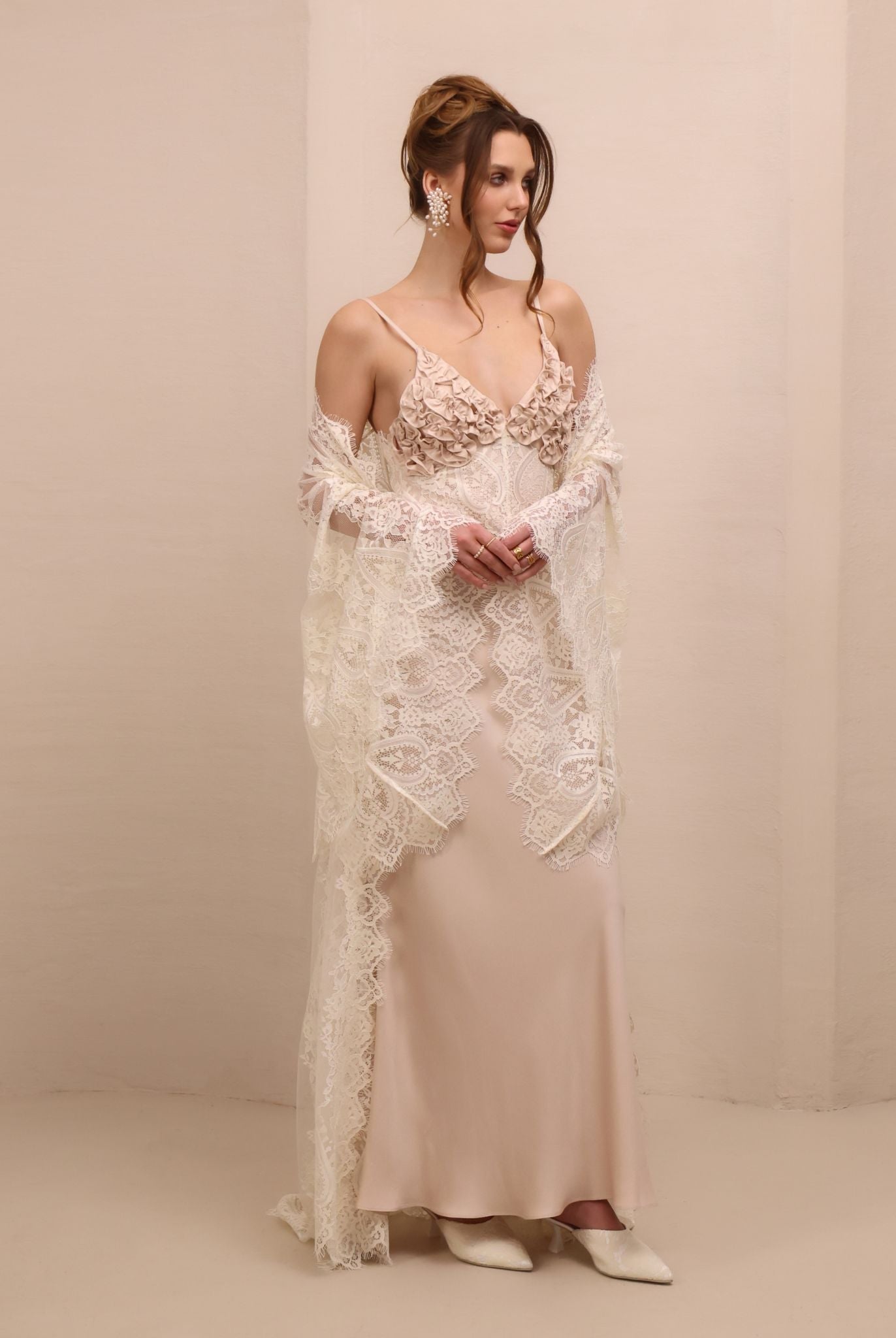 A shot of the ensemble with the robe draped over the shoulders, highlighting the sheer lace and romantic allure.